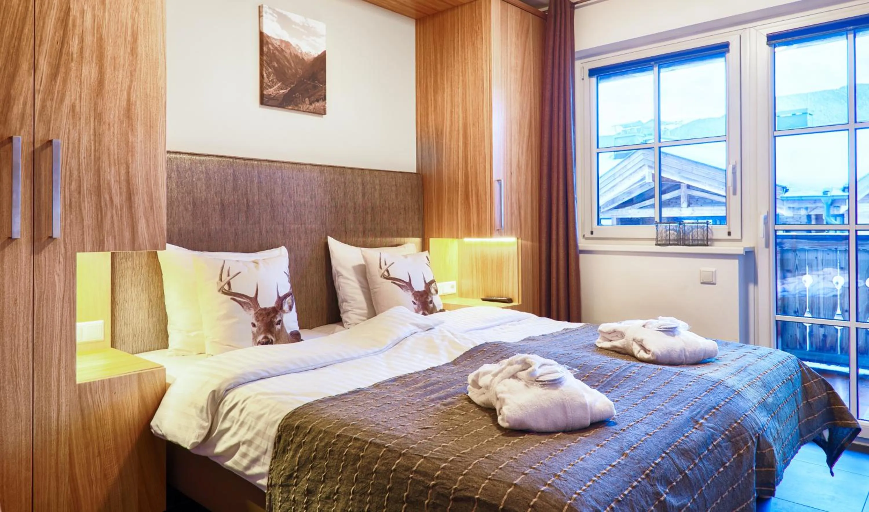 Bed in AvenidA Mountain Resort by Alpin Rentals