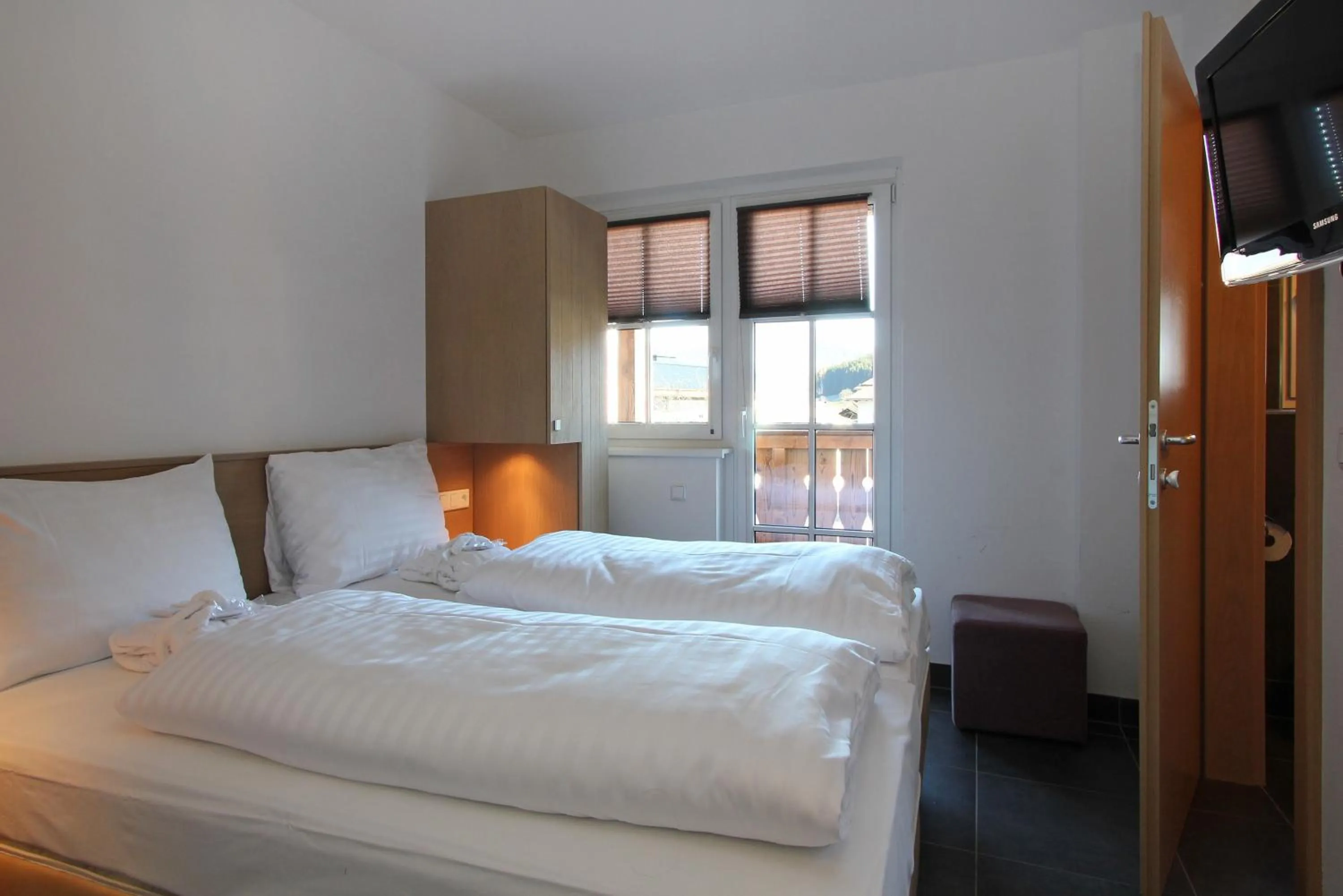 Bed in AvenidA Mountain Resort by Alpin Rentals