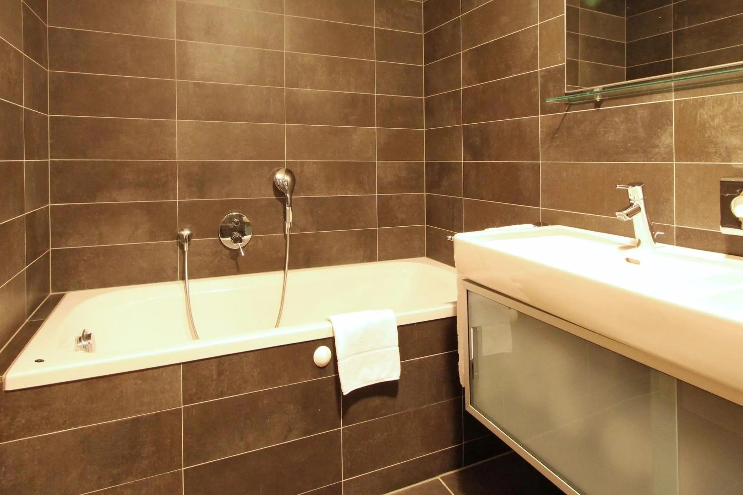 Bathroom in AvenidA Mountain Resort by Alpin Rentals