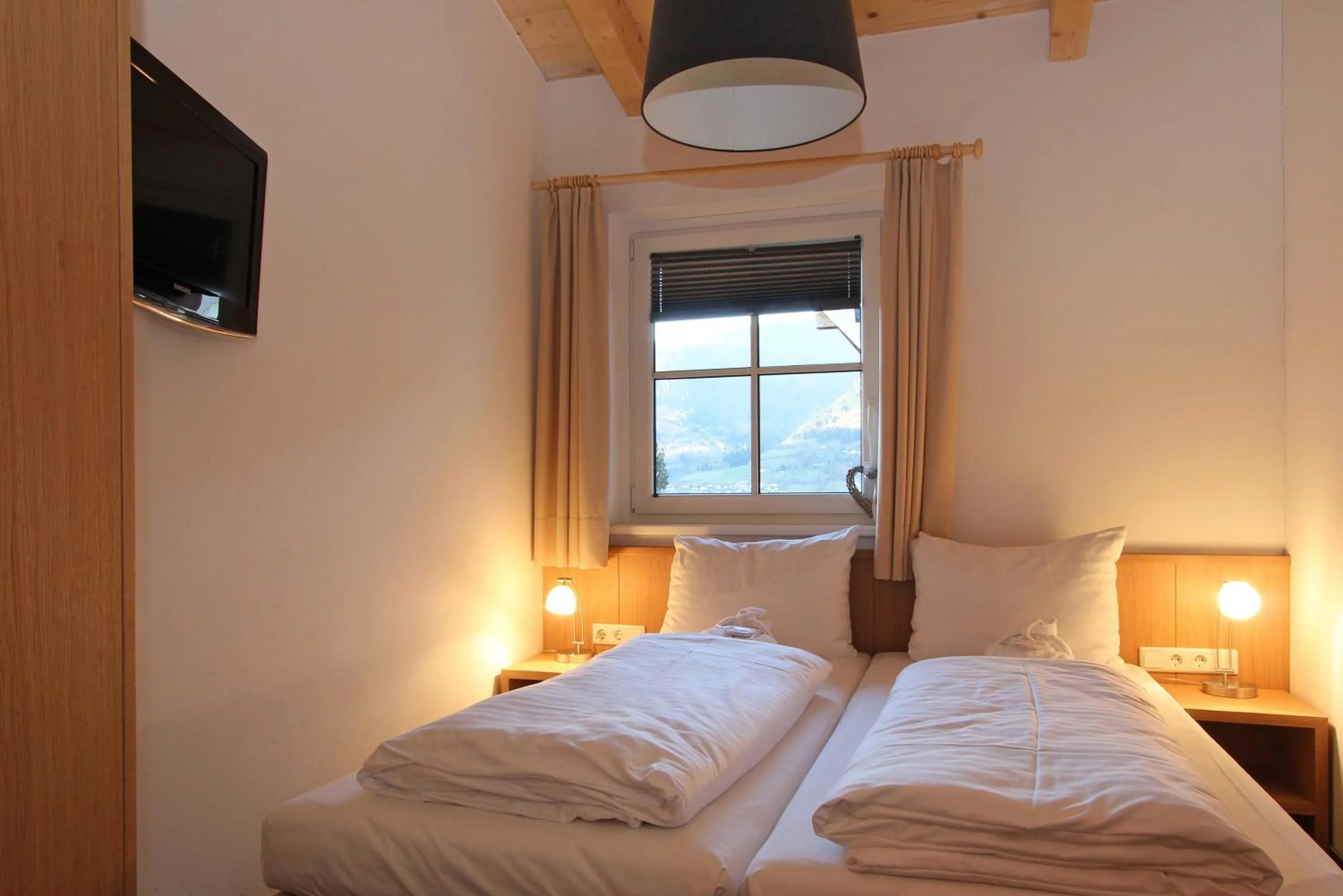Bed in AvenidA Mountain Resort by Alpin Rentals