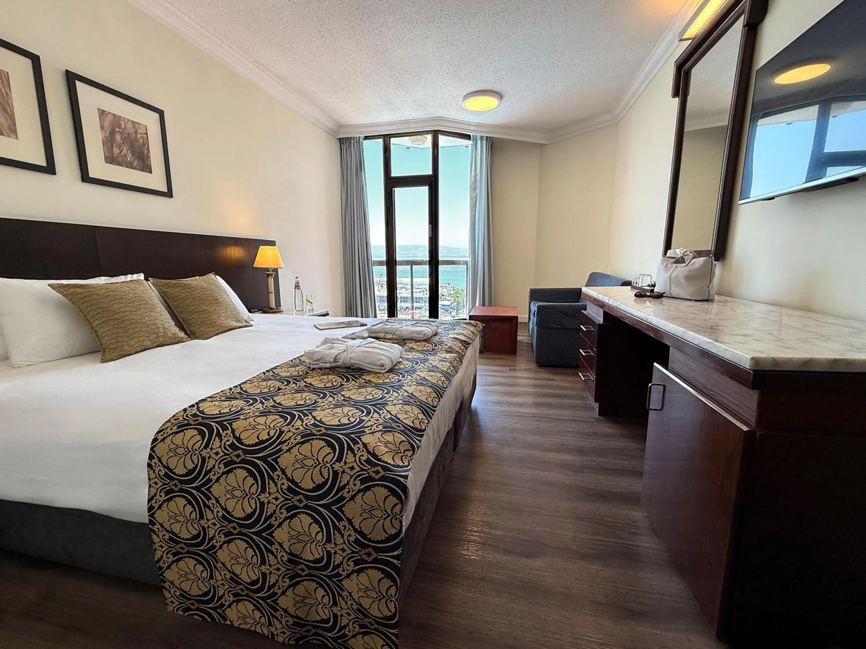 Bed in Caesar Premier Tiberias Hotel