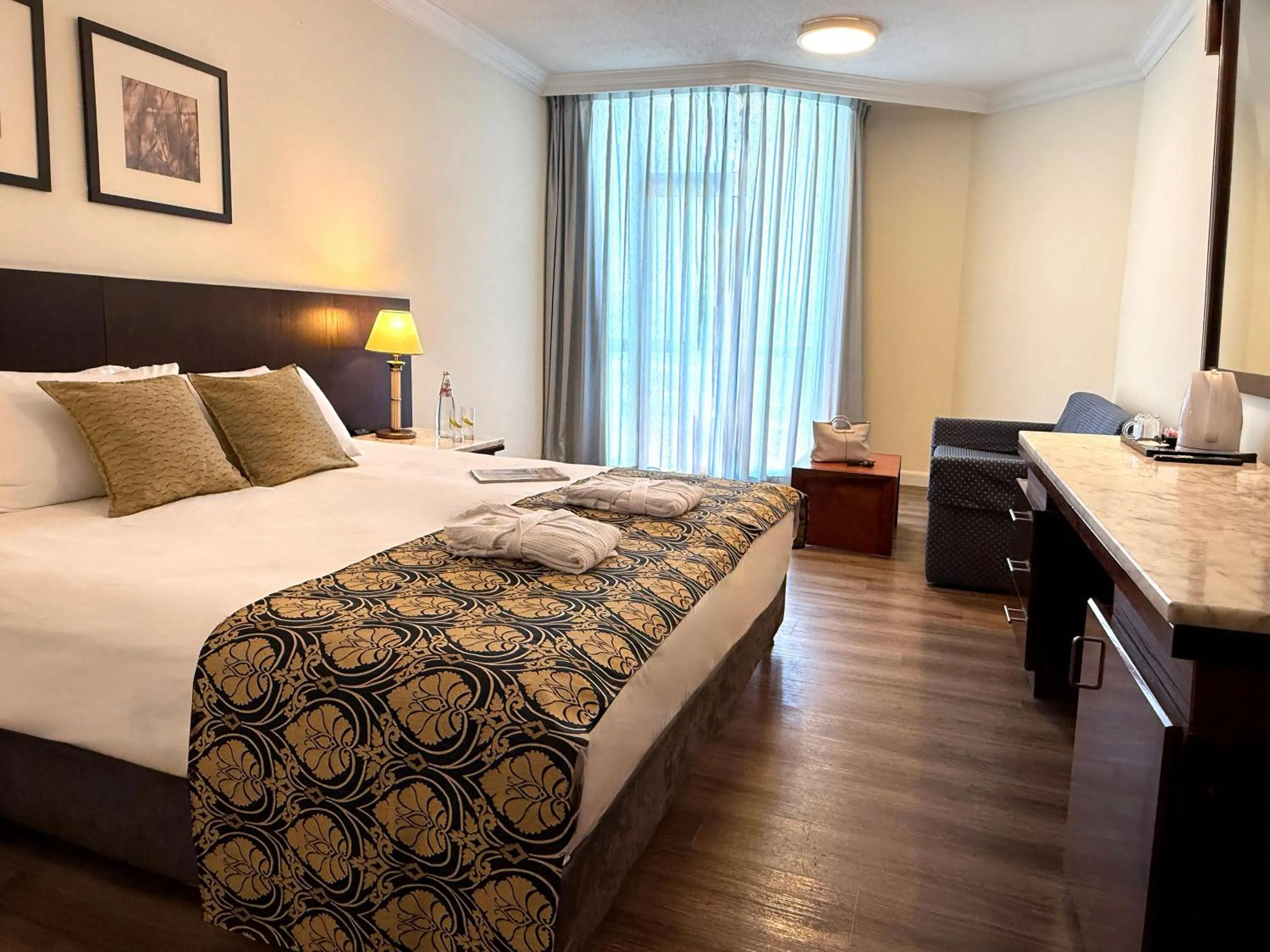 Bed in Caesar Premier Tiberias Hotel