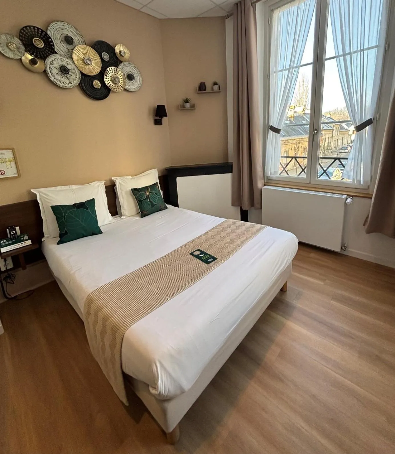 Bed in Logis Hotel Beaudon