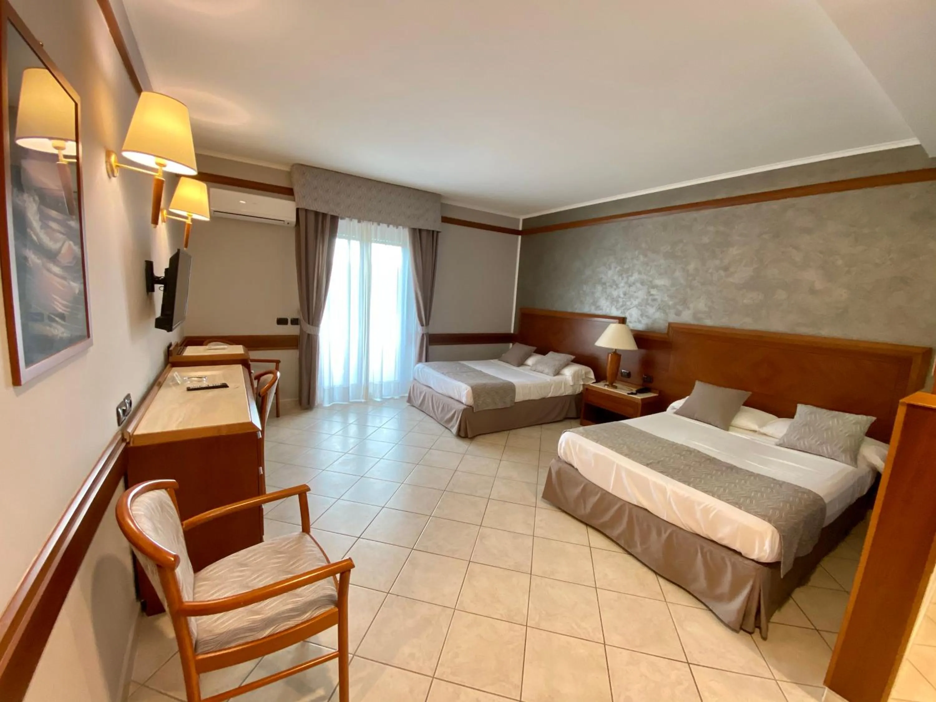 Bed in Hotel Le Palme