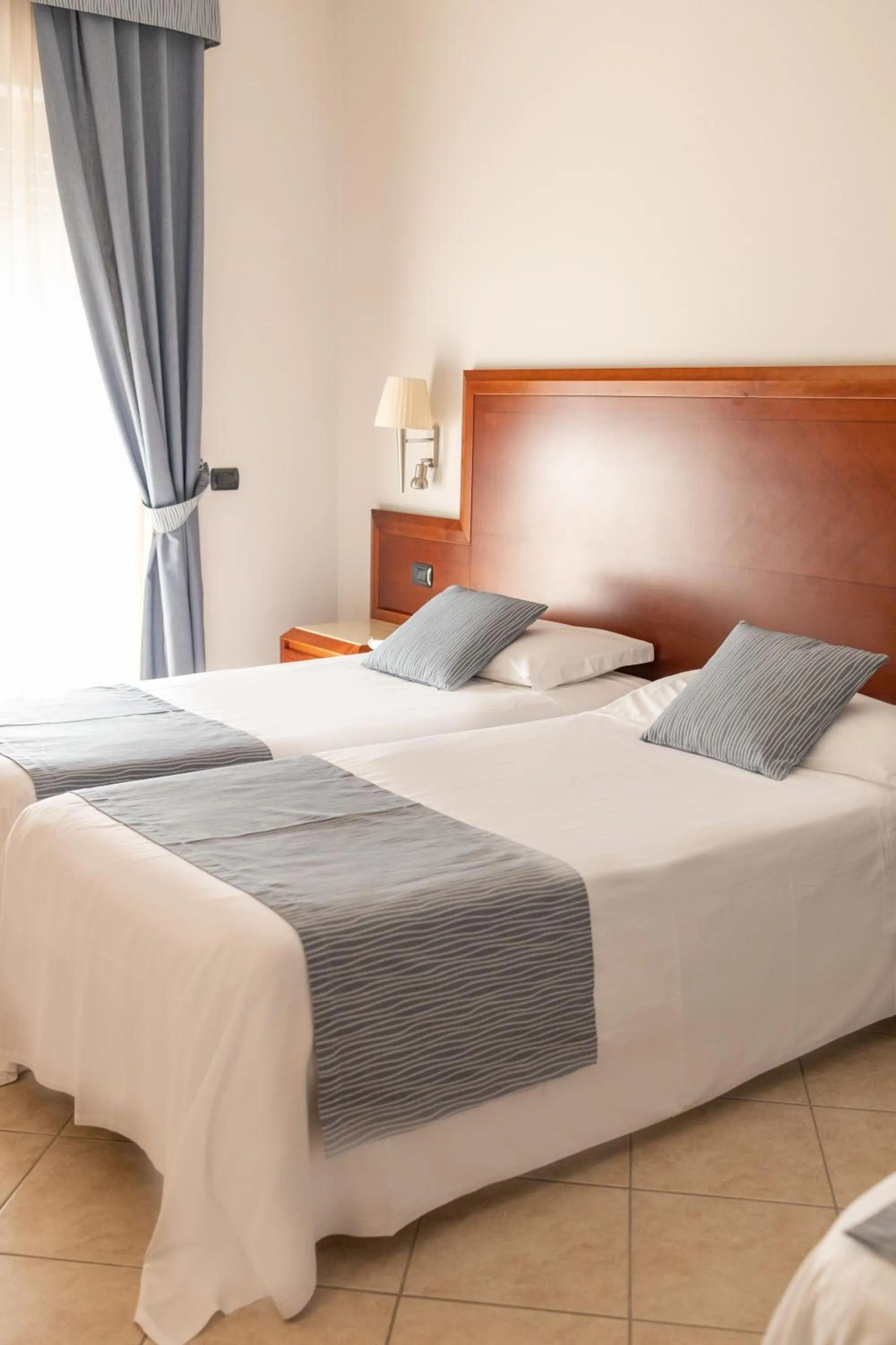 Bed in Hotel Le Palme