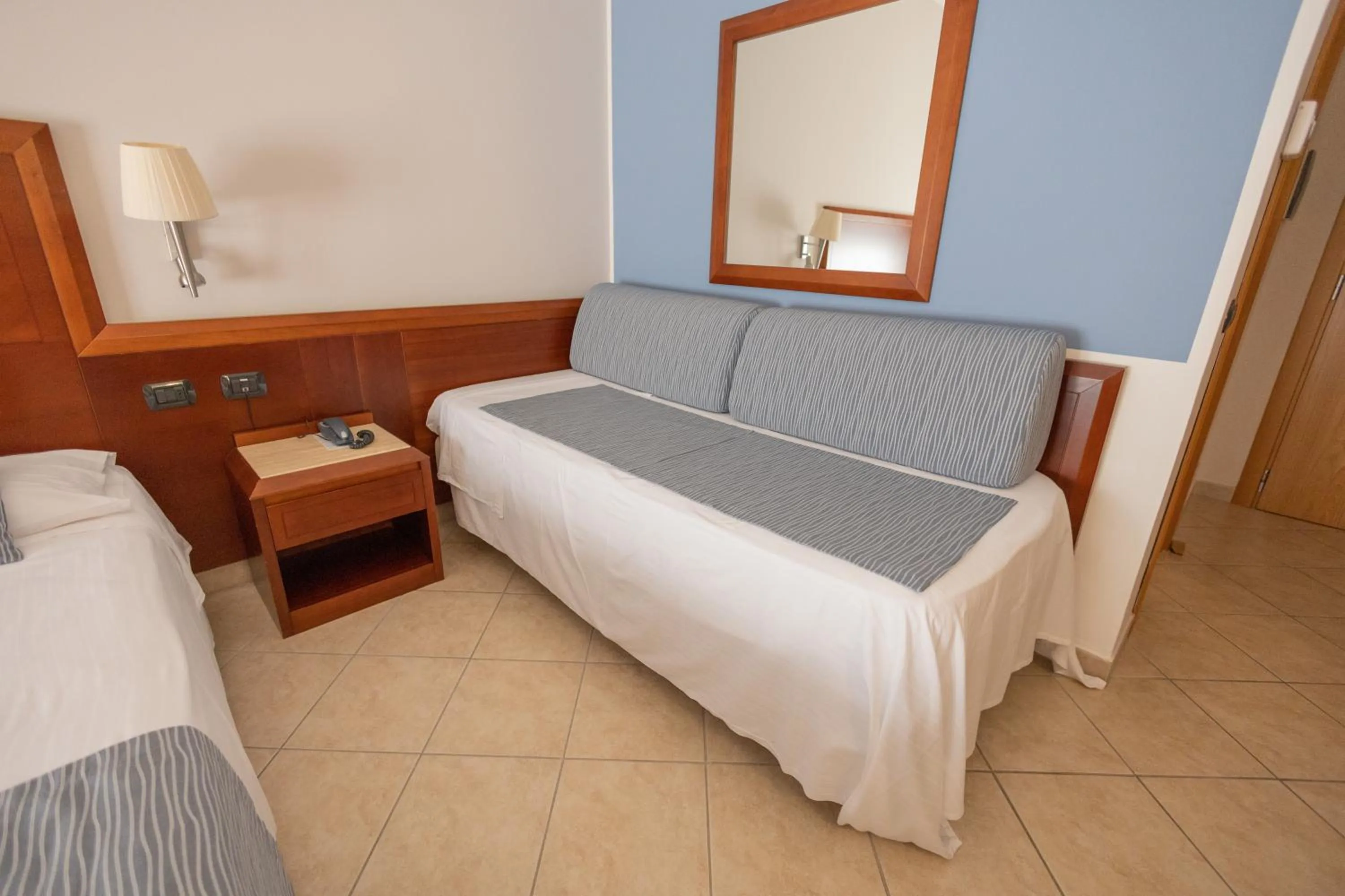 Bed in Hotel Le Palme