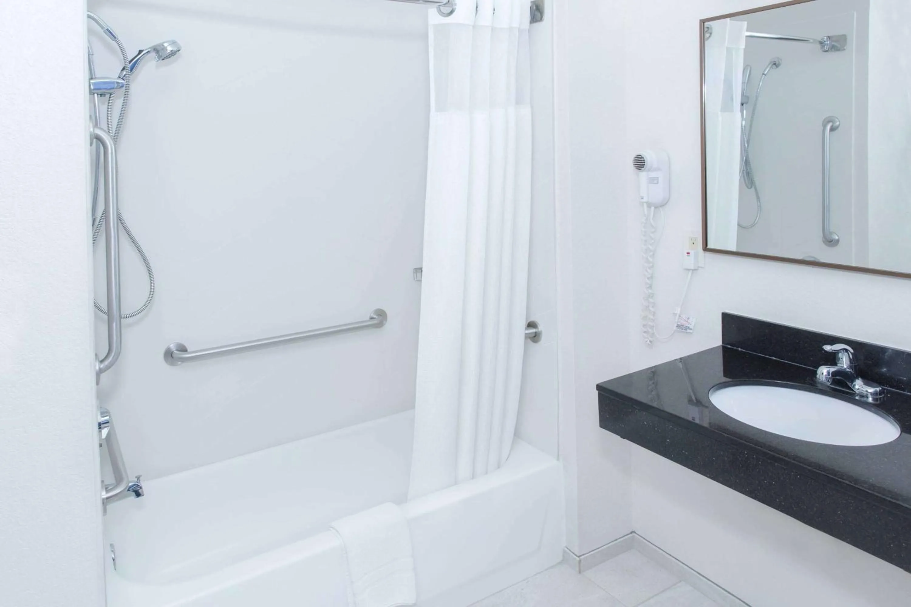 Bathroom in AmericInn by Wyndham Hays