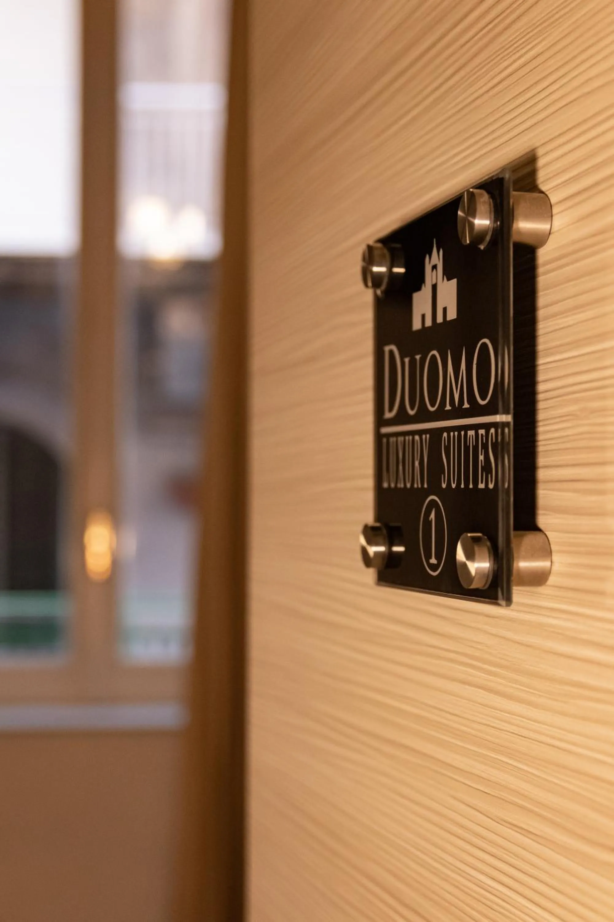 Property logo or sign in Duomo Luxury Suites