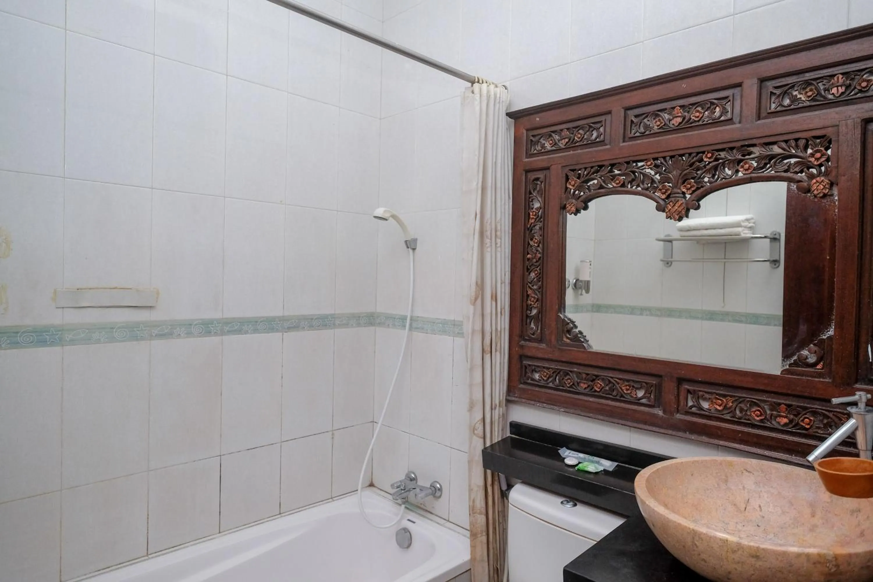 Bathroom in Urbanview Omah Eka Santi by RedDoorz