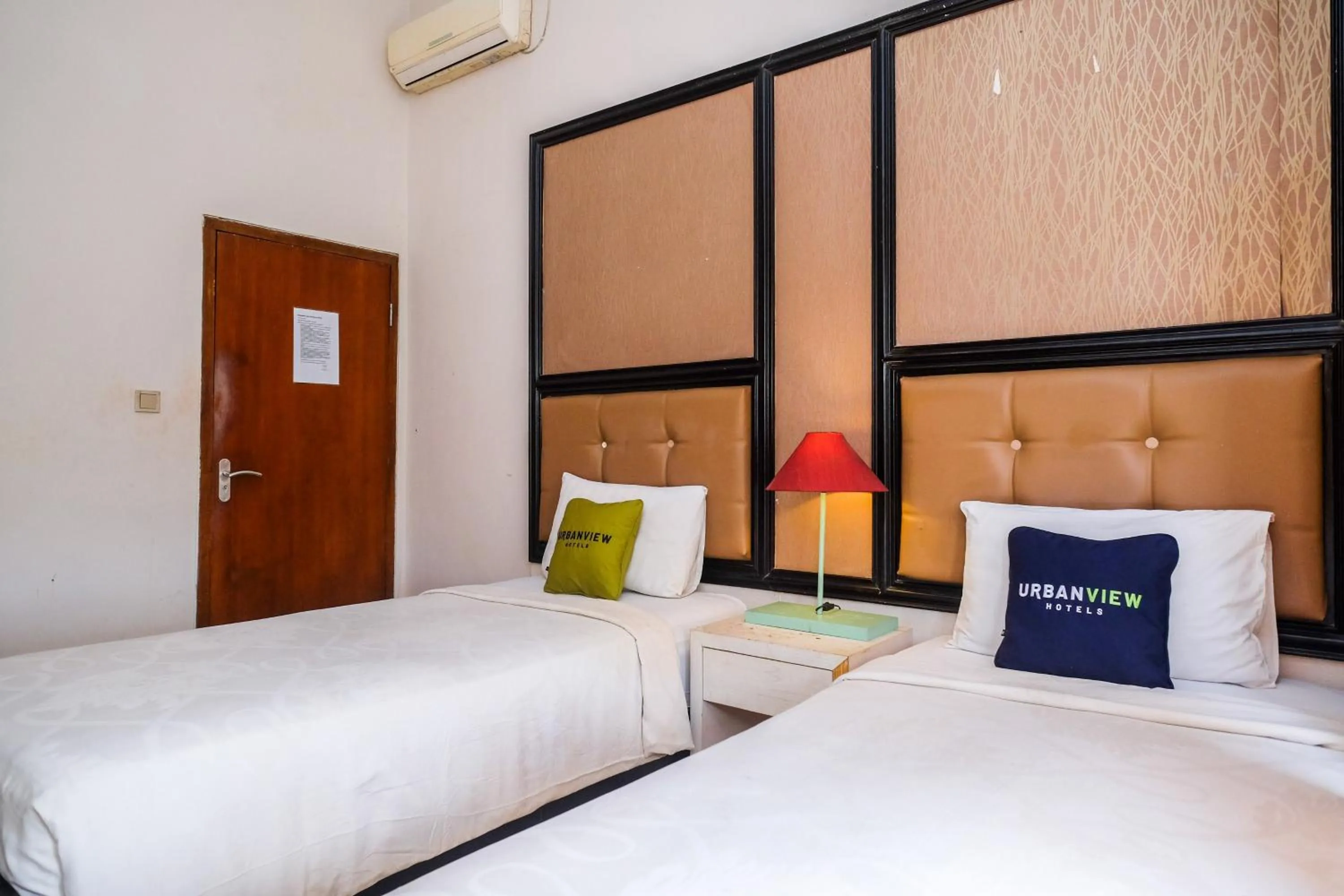 Bedroom, Bed in Urbanview Omah Eka Santi by RedDoorz