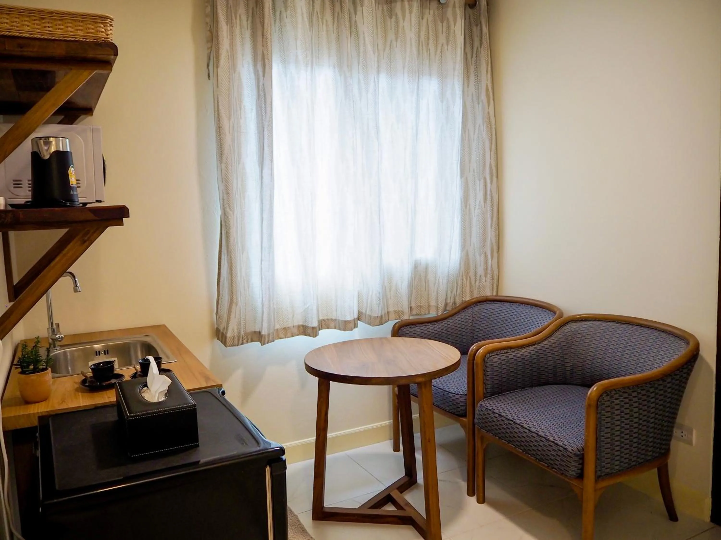 Seating area in Baan Dan Ta Wan Nuea