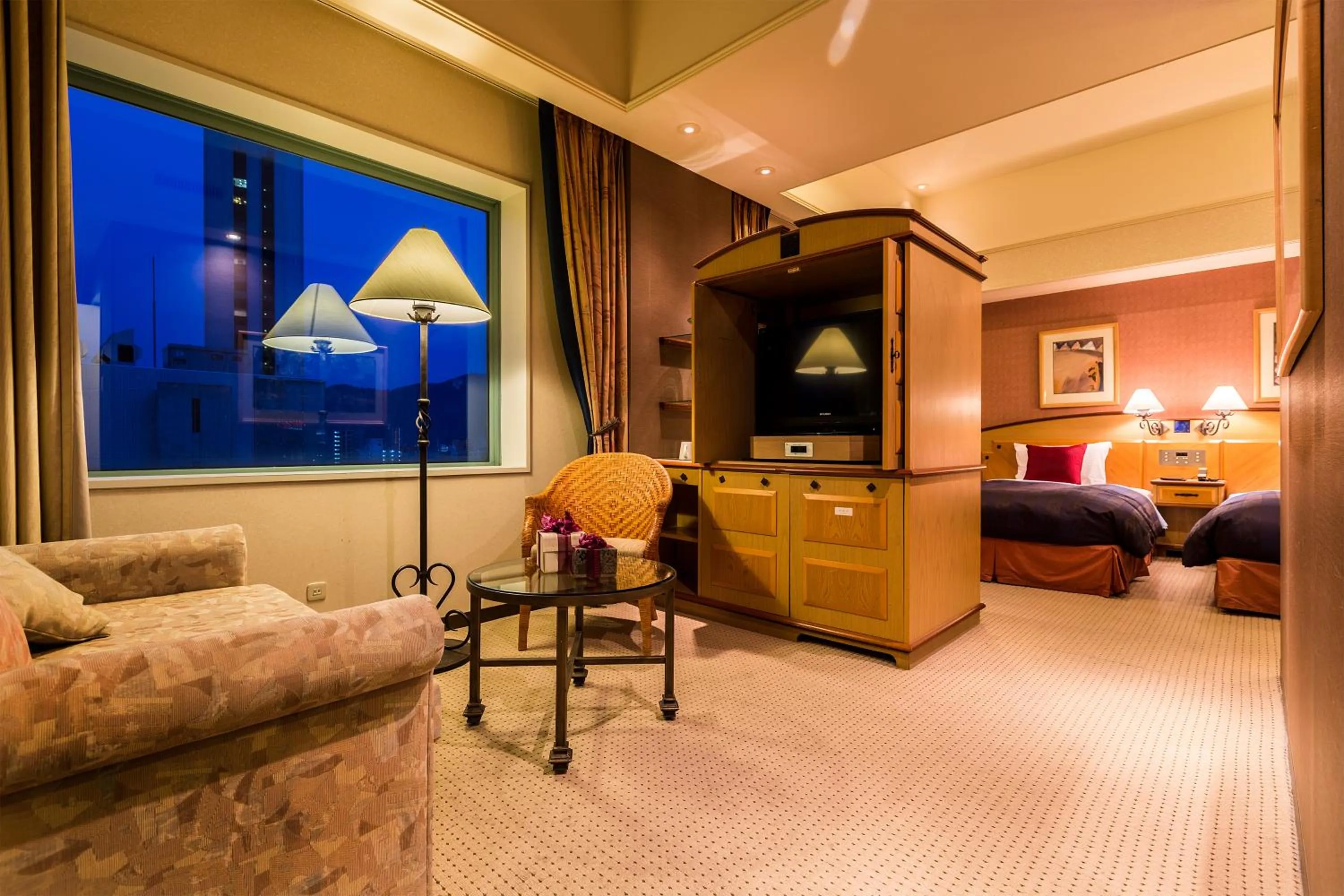 Living room, Bed in Hotel Resol Sapporo Nakajima Koen