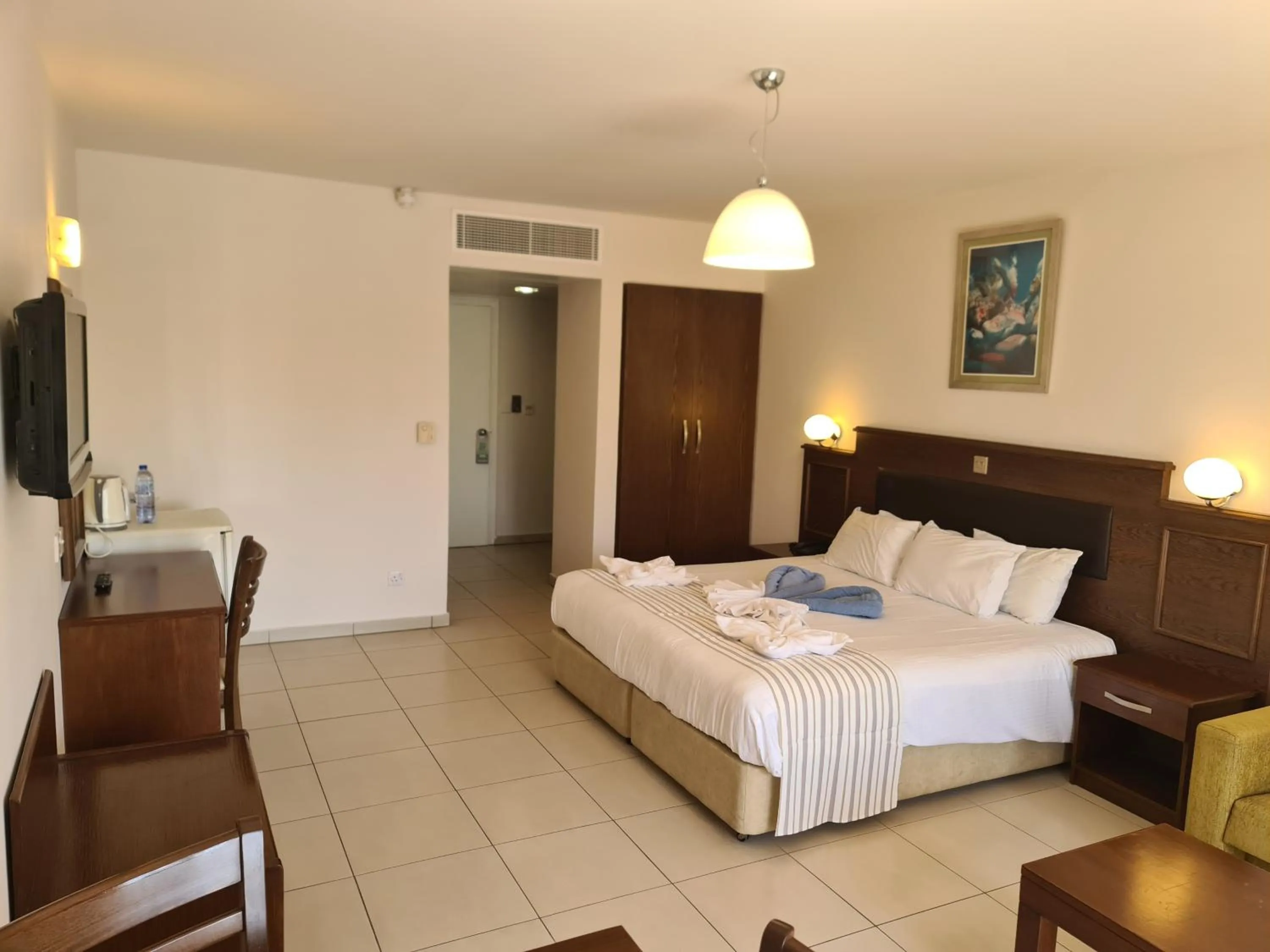 Bed in Euronapa Hotel Apartments