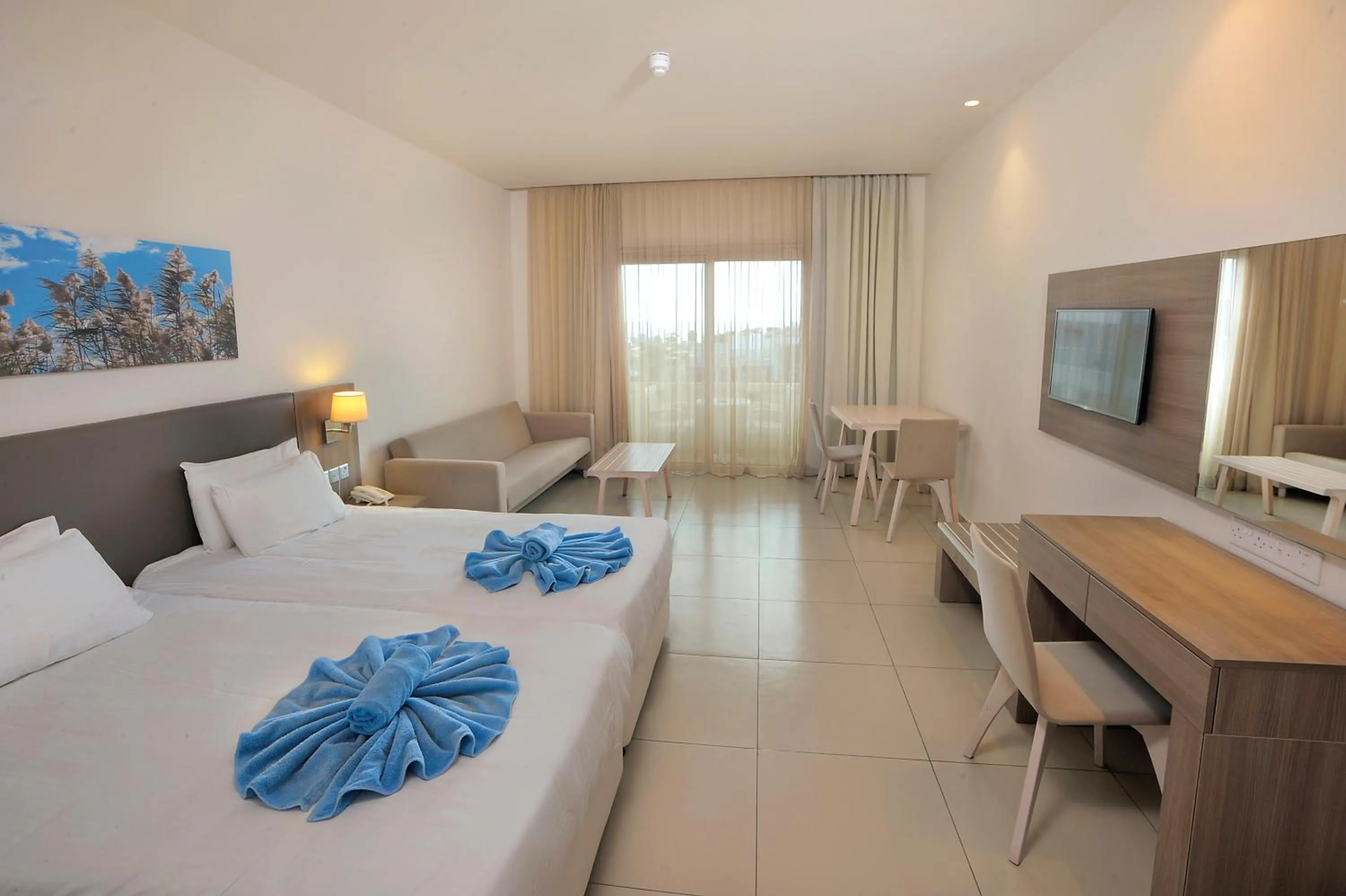 Bed in Euronapa Hotel Apartments