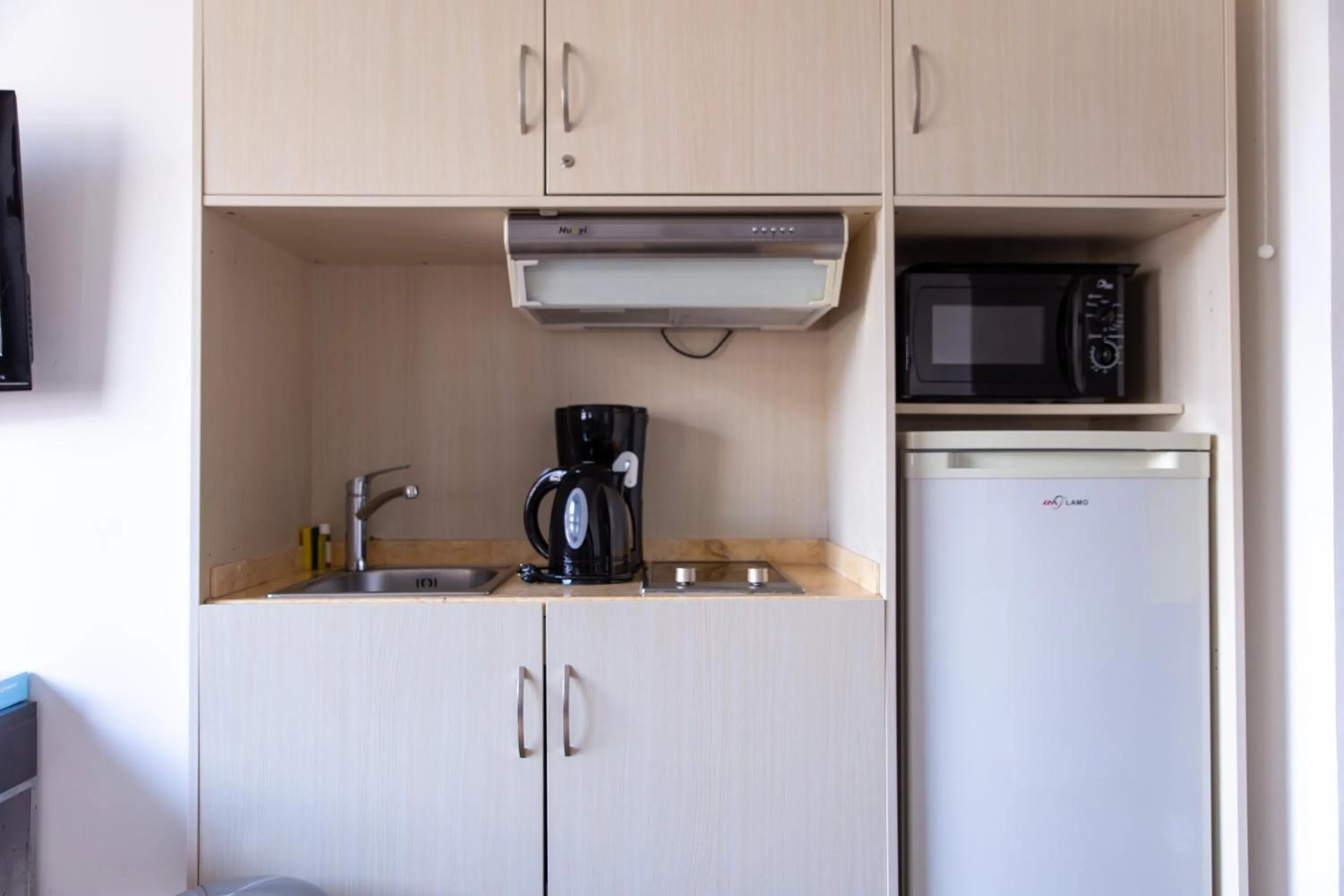 Kitchen or kitchenette in Zenitude Swiss Apparthotels