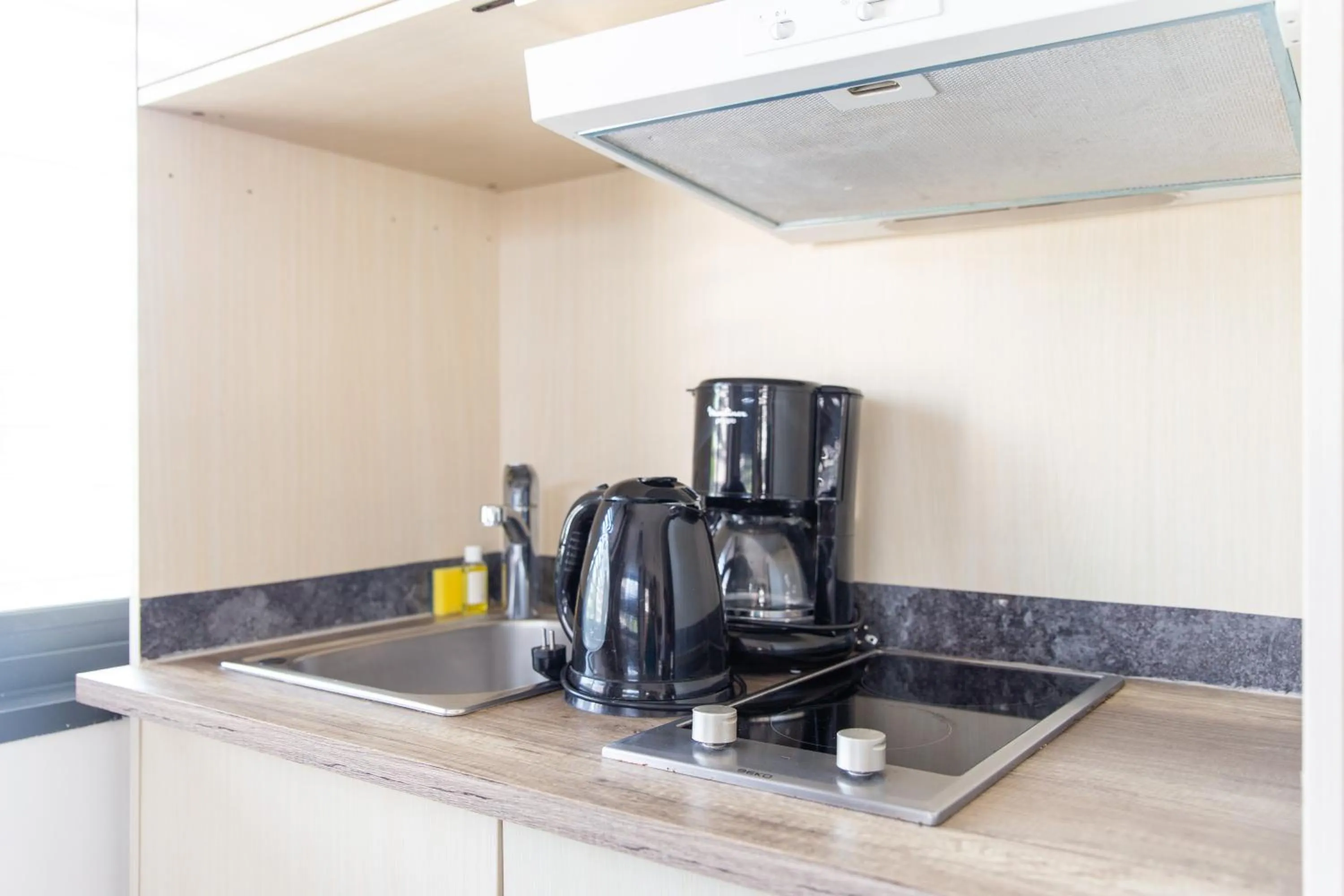 Kitchen or kitchenette in Zenitude Swiss Apparthotels