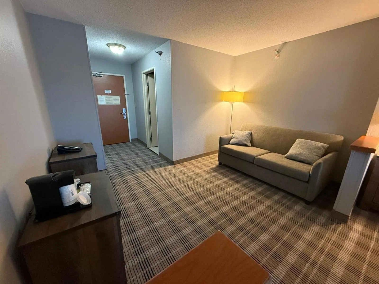 Living room in AmericInn by Wyndham Minot