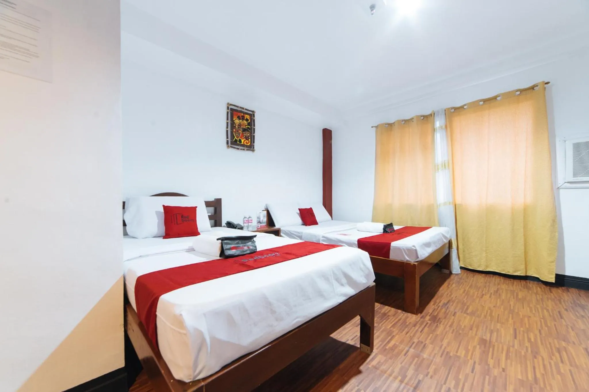 Bed in RedDoorz at Nirvana Pension House