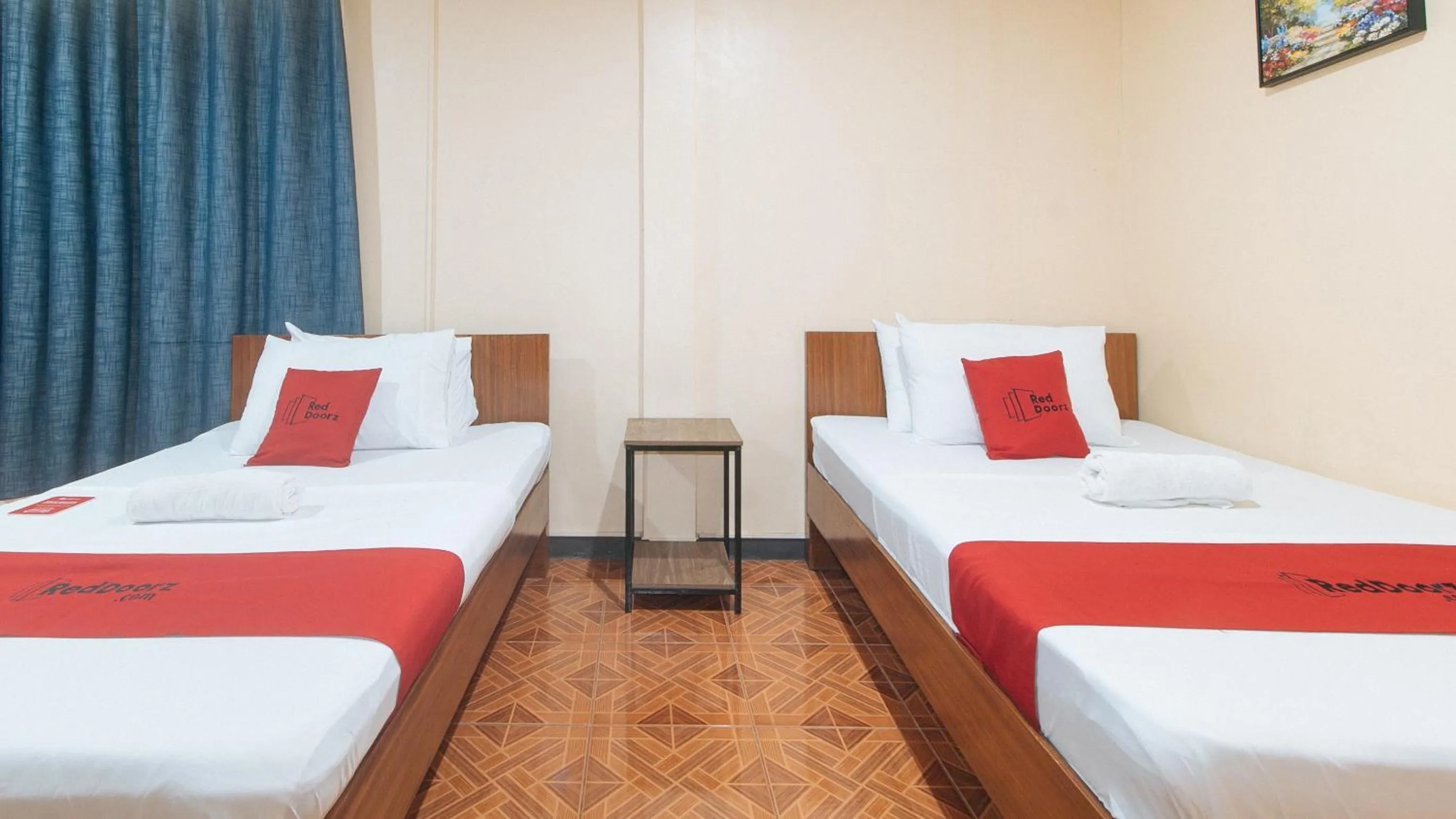 Bed in RedDoorz at Nirvana Pension House