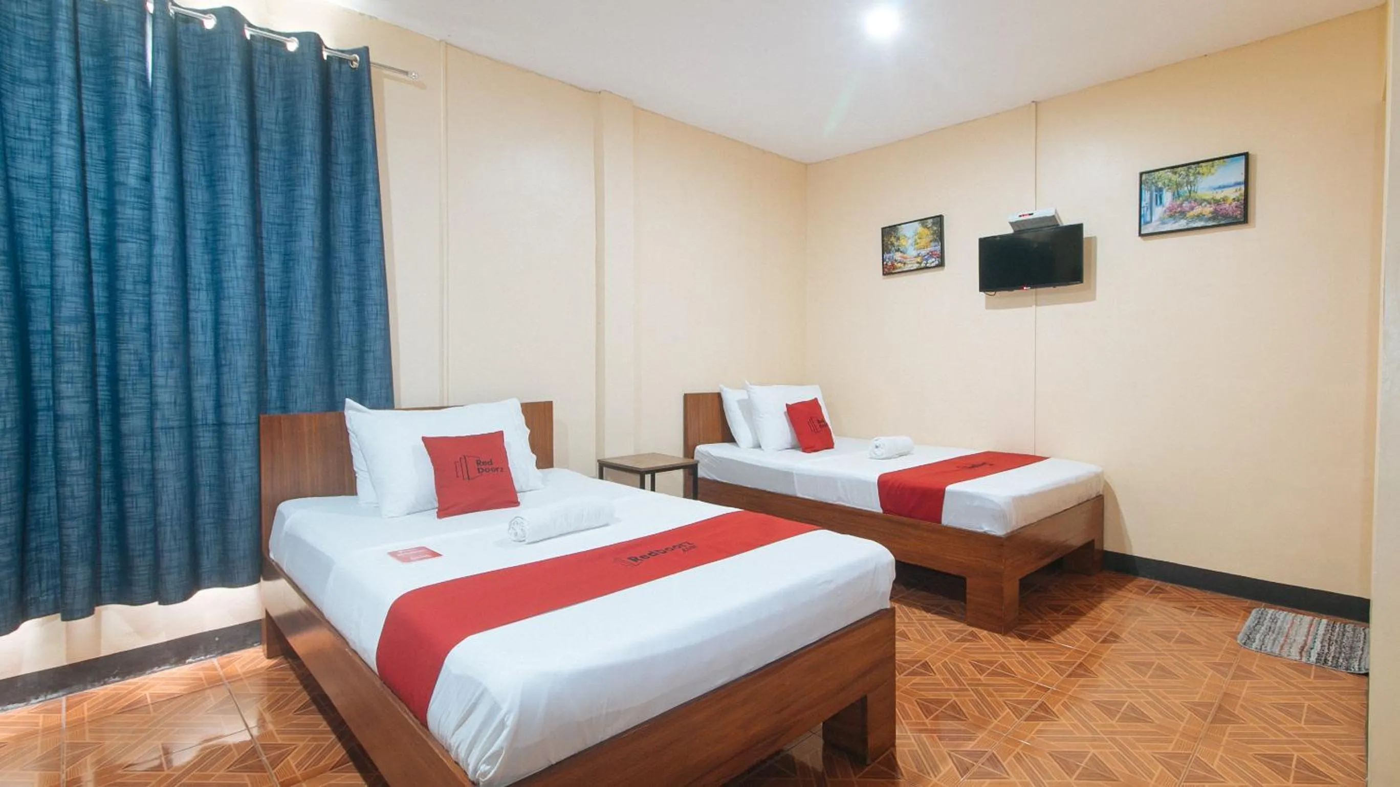 Bed in RedDoorz at Nirvana Pension House