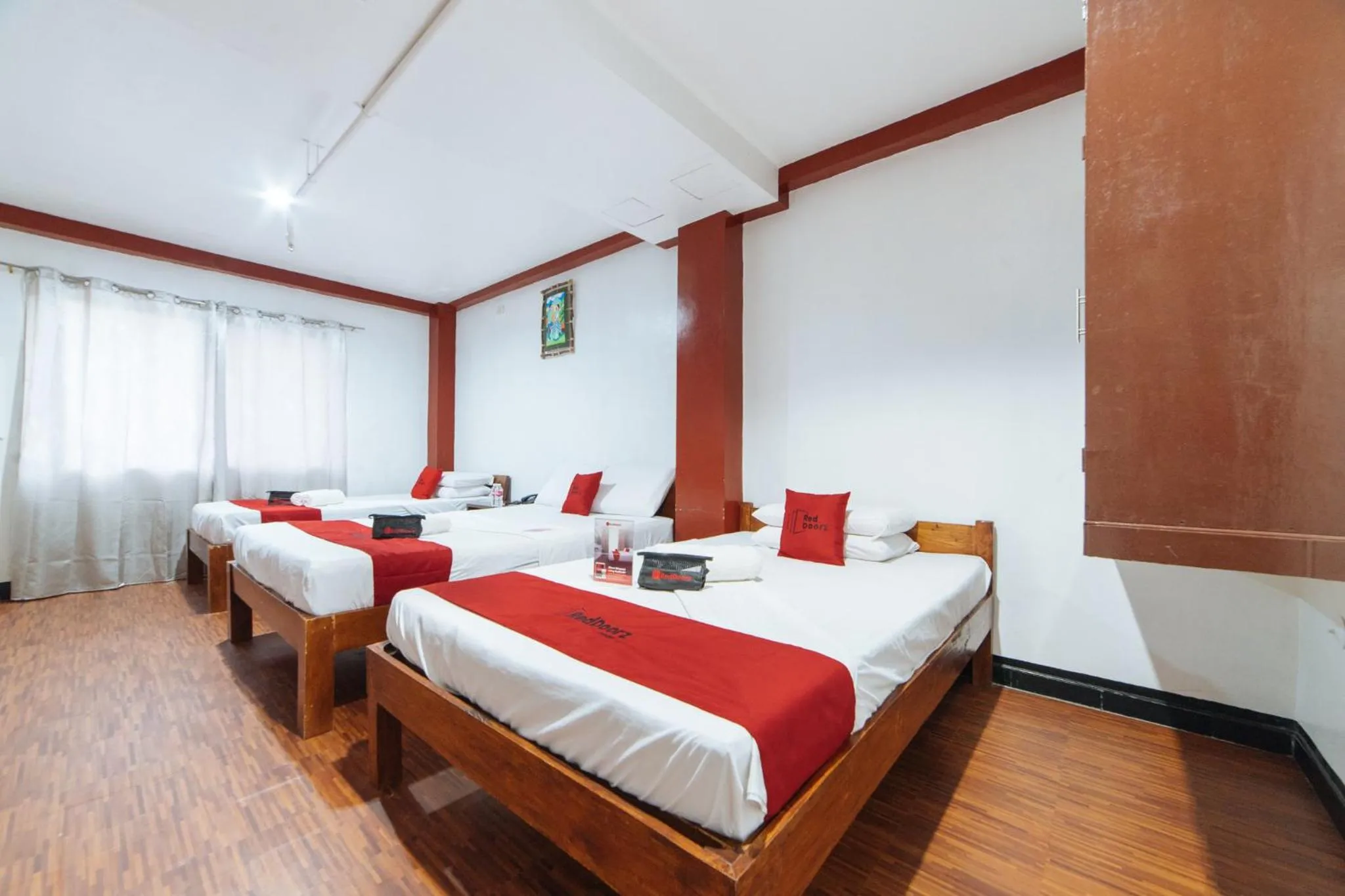 Bed in RedDoorz at Nirvana Pension House