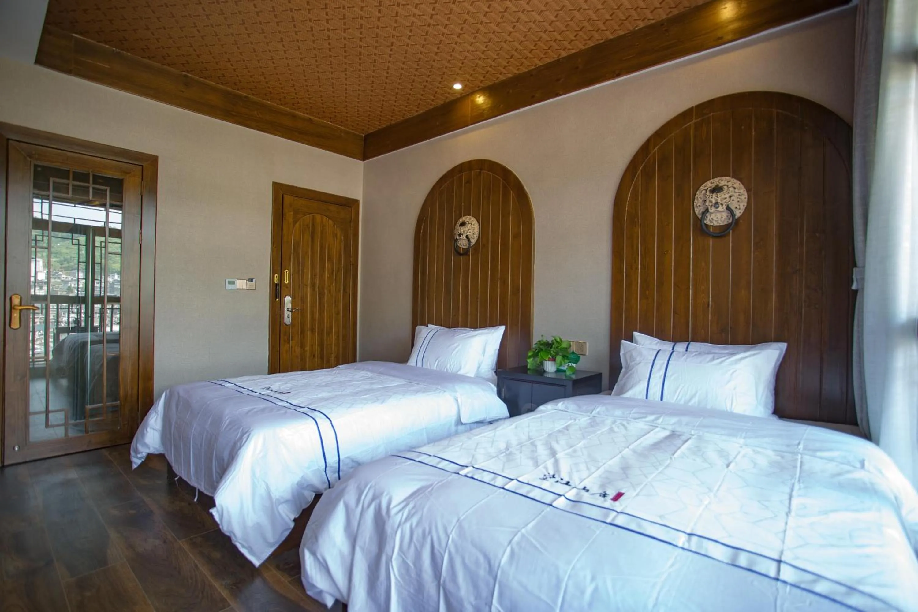 Bed in Wang Jiang Reclusive Boutique Inn