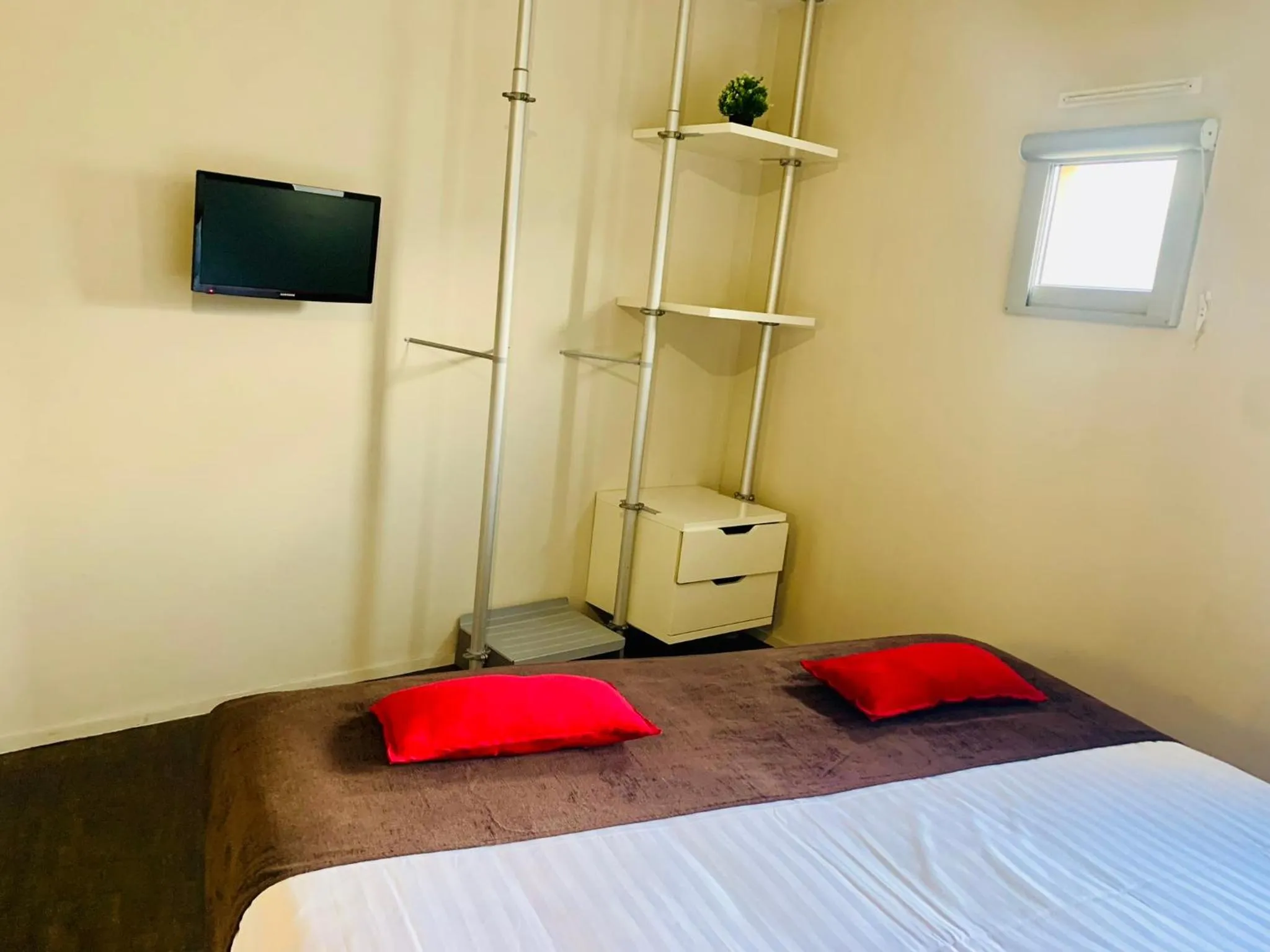 Bed in Standing Hotel Suites by Actisource