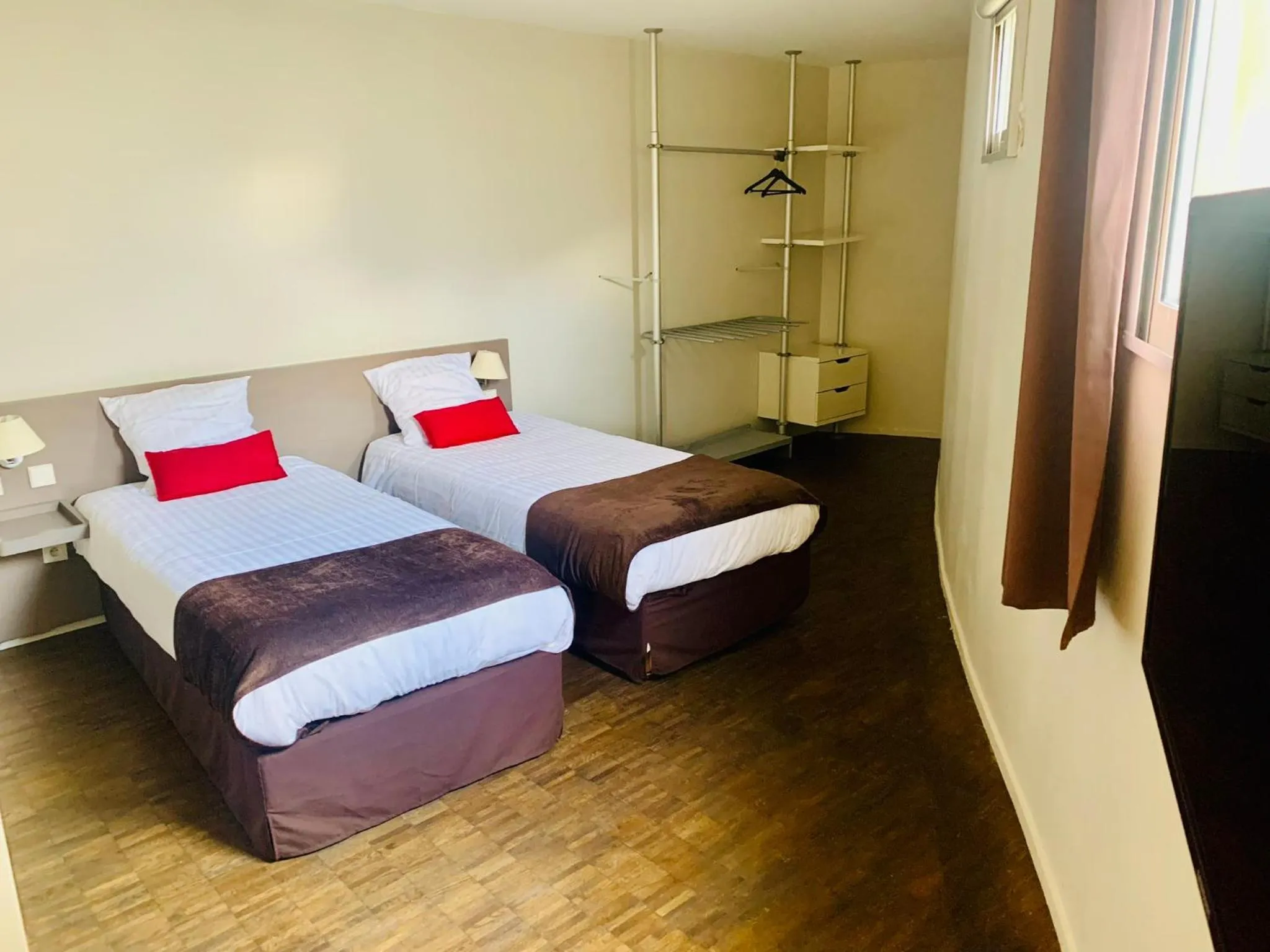 Bed in Standing Hotel Suites by Actisource