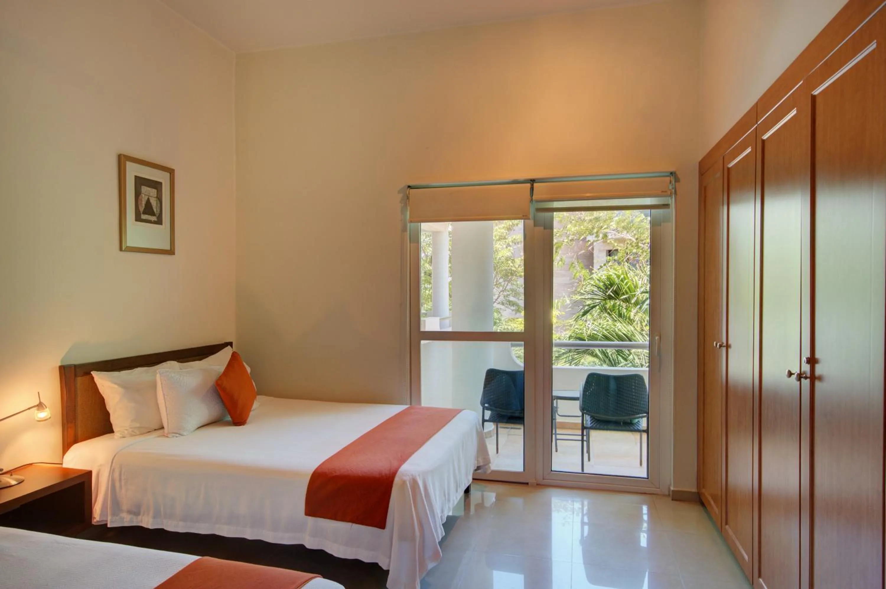 Bed in Riviera Maya Suites