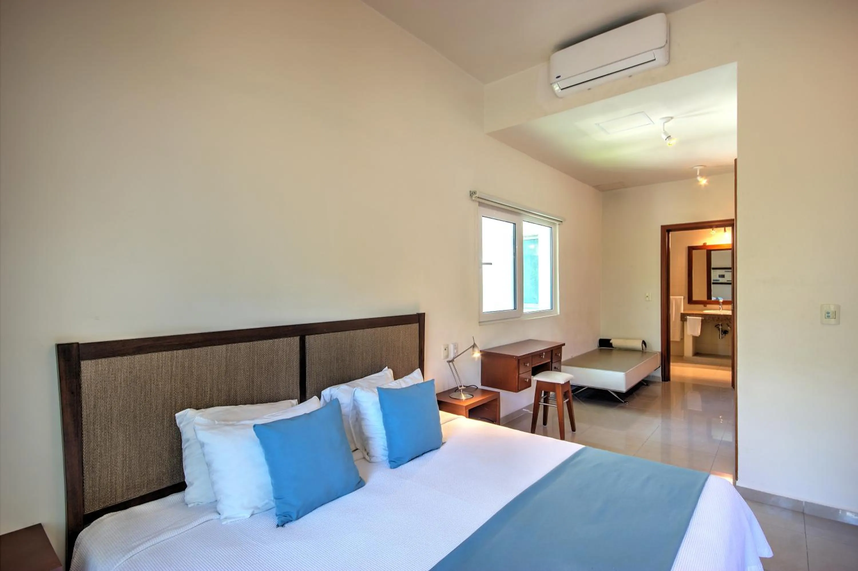 Bed in Riviera Maya Suites