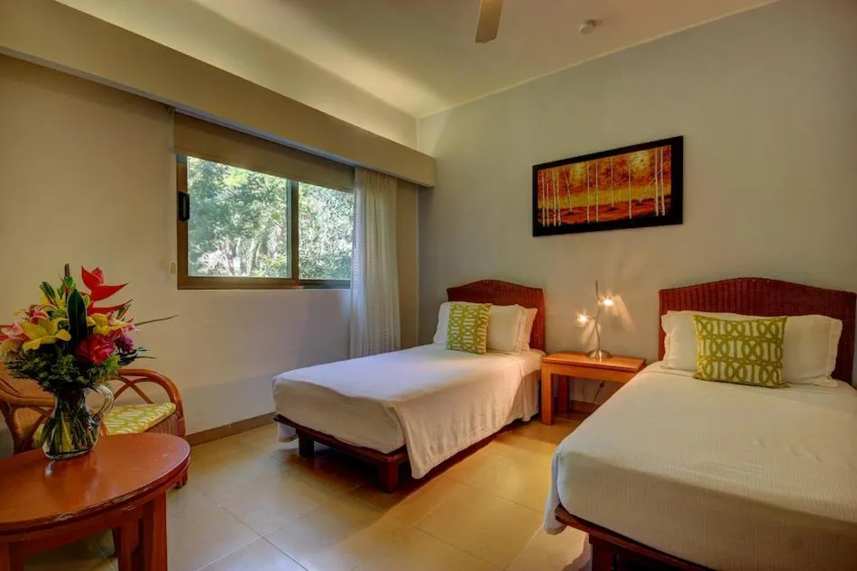 Bed in Riviera Maya Suites