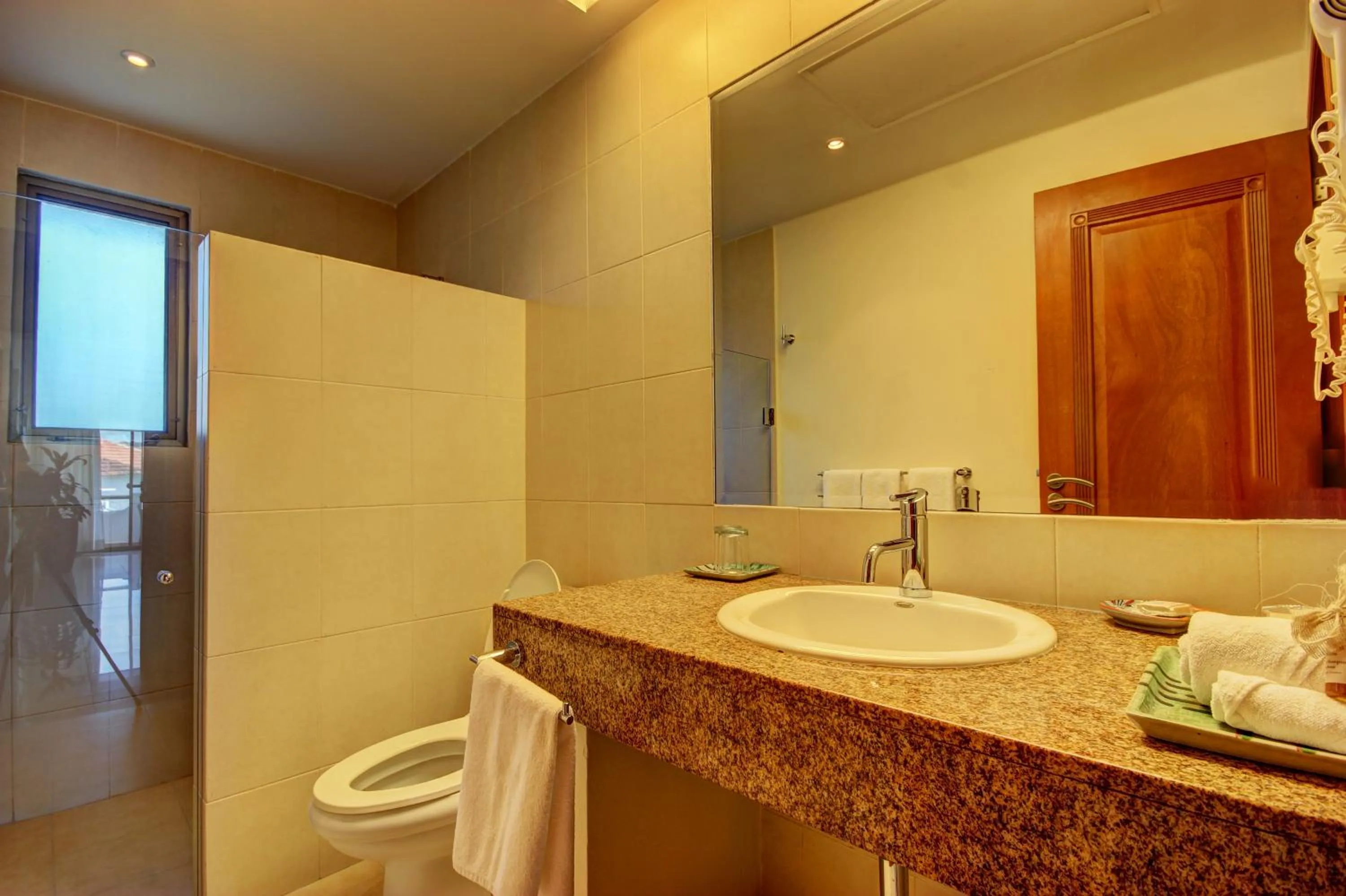 Toilet in Riviera Maya Suites