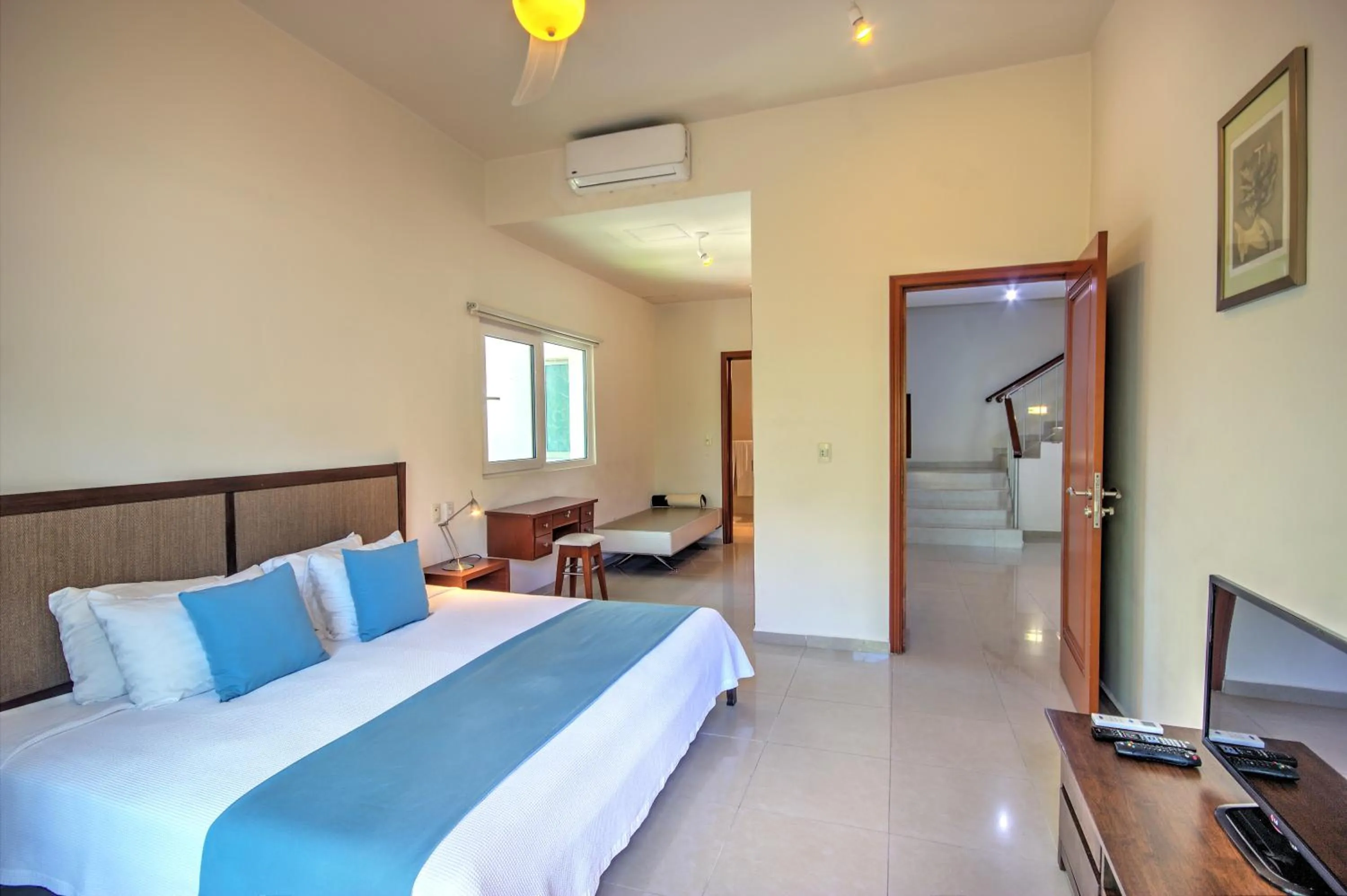 Bed in Riviera Maya Suites