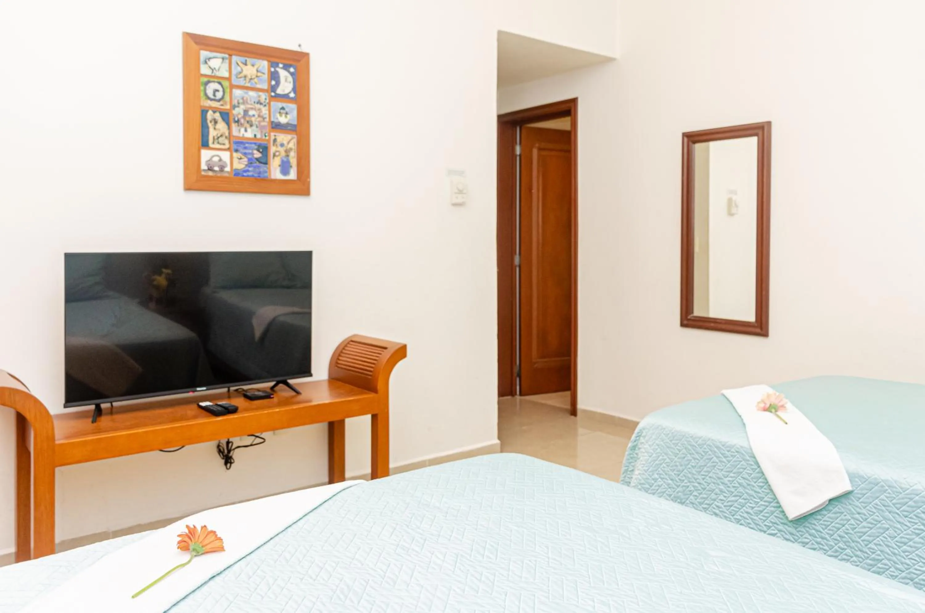 Bed in Riviera Maya Suites