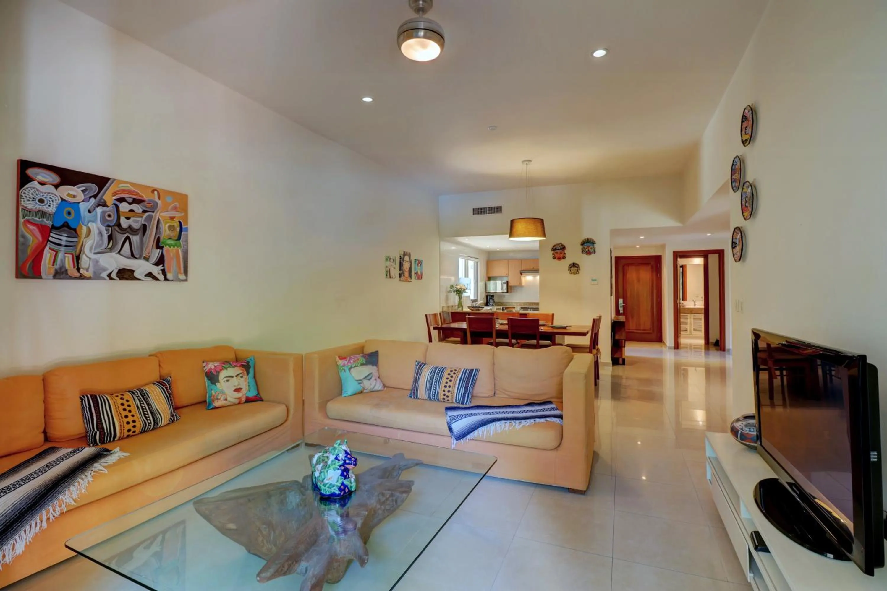 Communal lounge/ TV room in Riviera Maya Suites