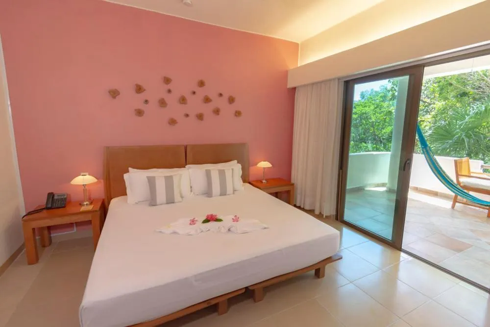 Bed in Riviera Maya Suites