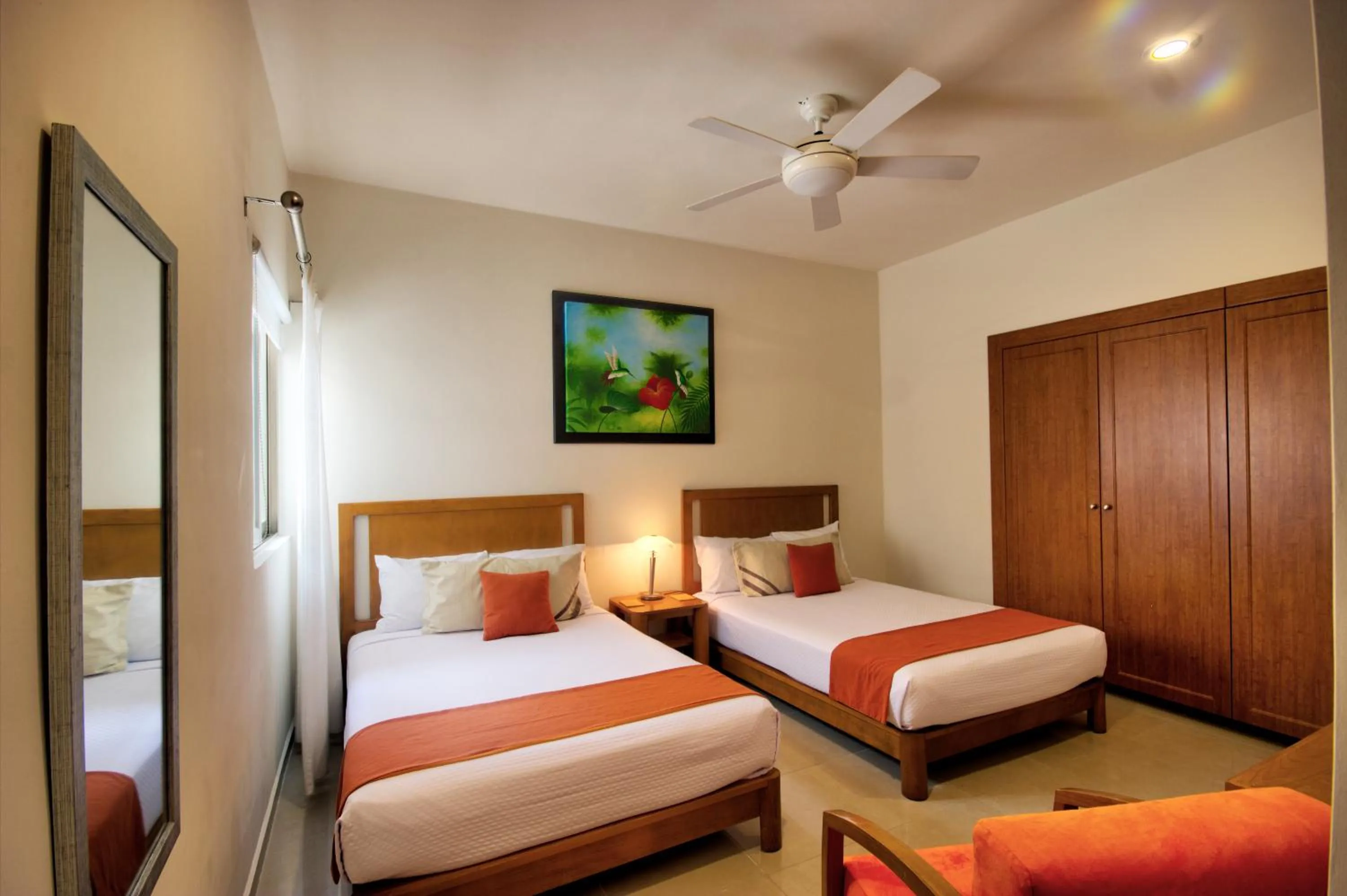 Bed in Riviera Maya Suites