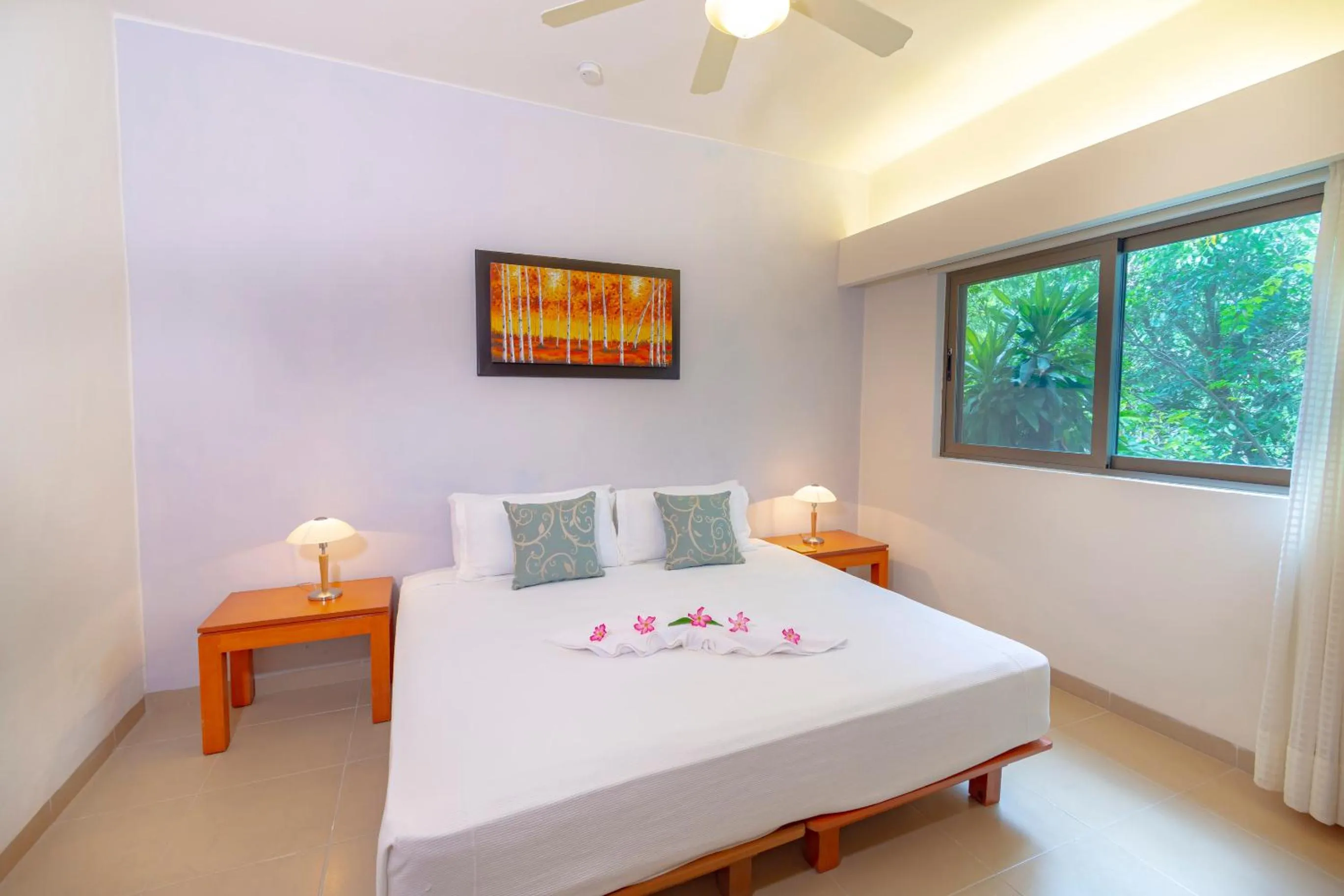 Bed in Riviera Maya Suites