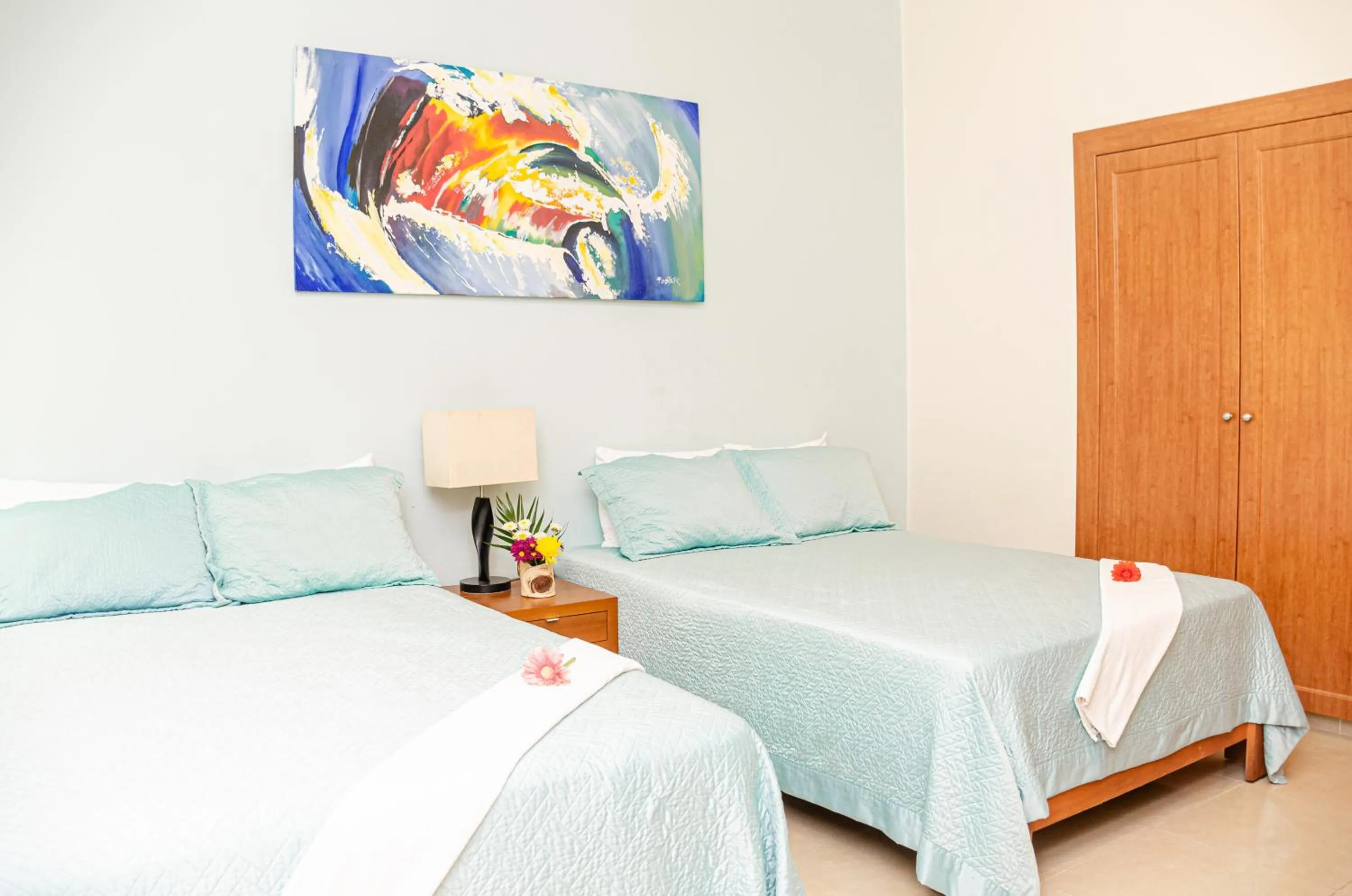 Bed in Riviera Maya Suites