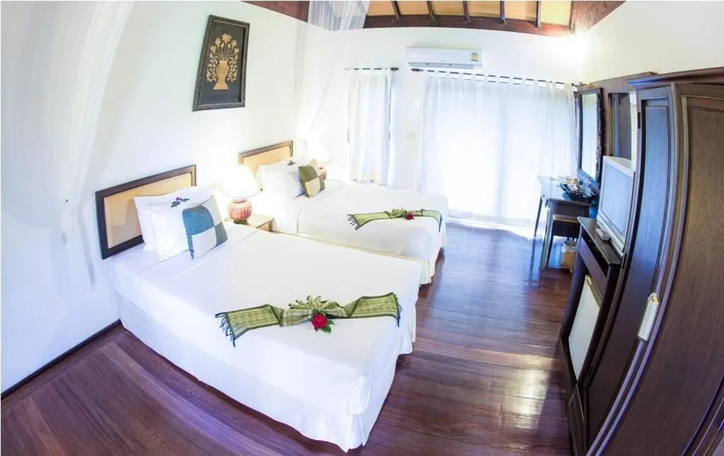 Bed in Golden Pine Resort and Spa