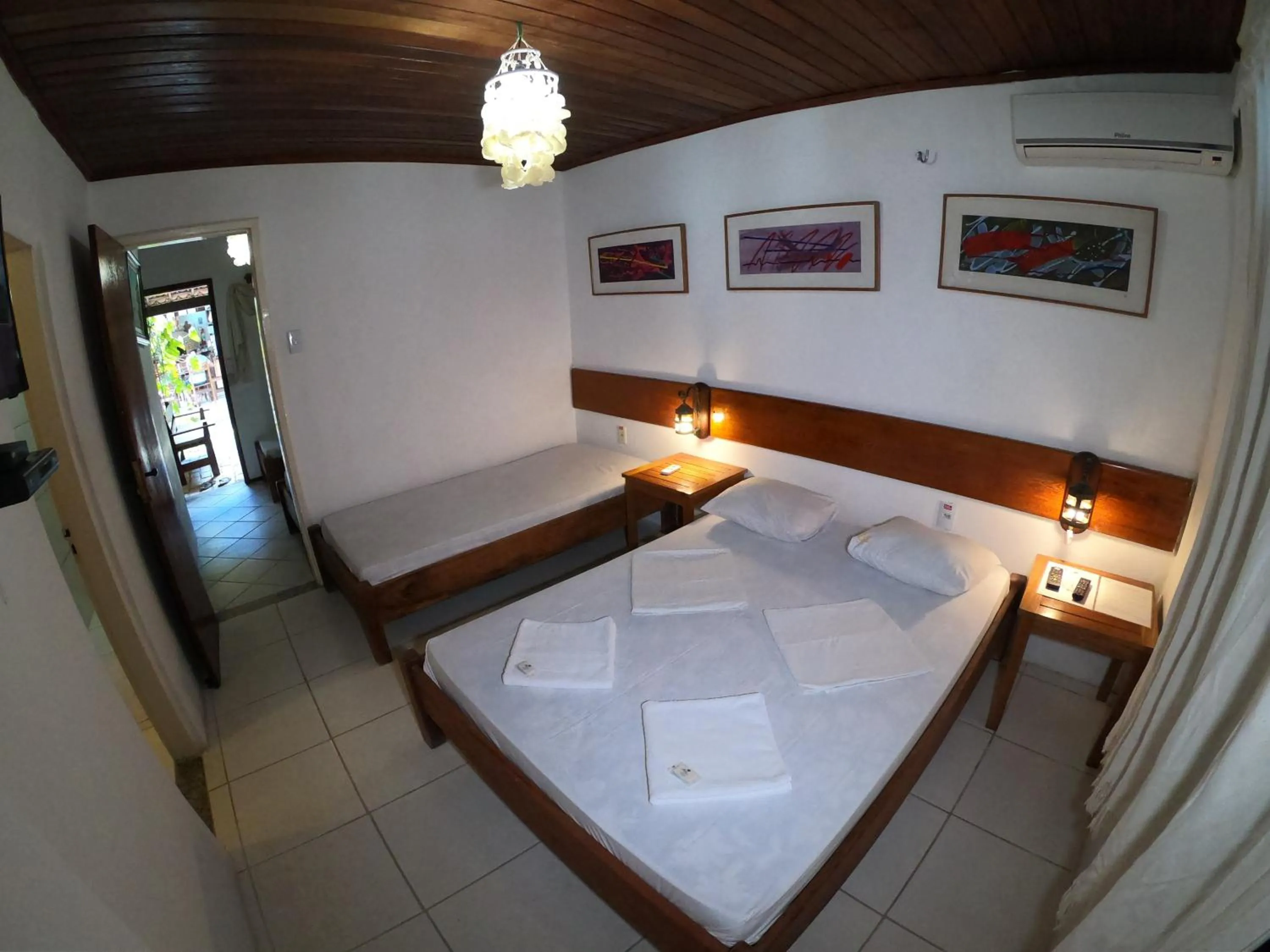 Bed in Pousada Casa Do Angelo