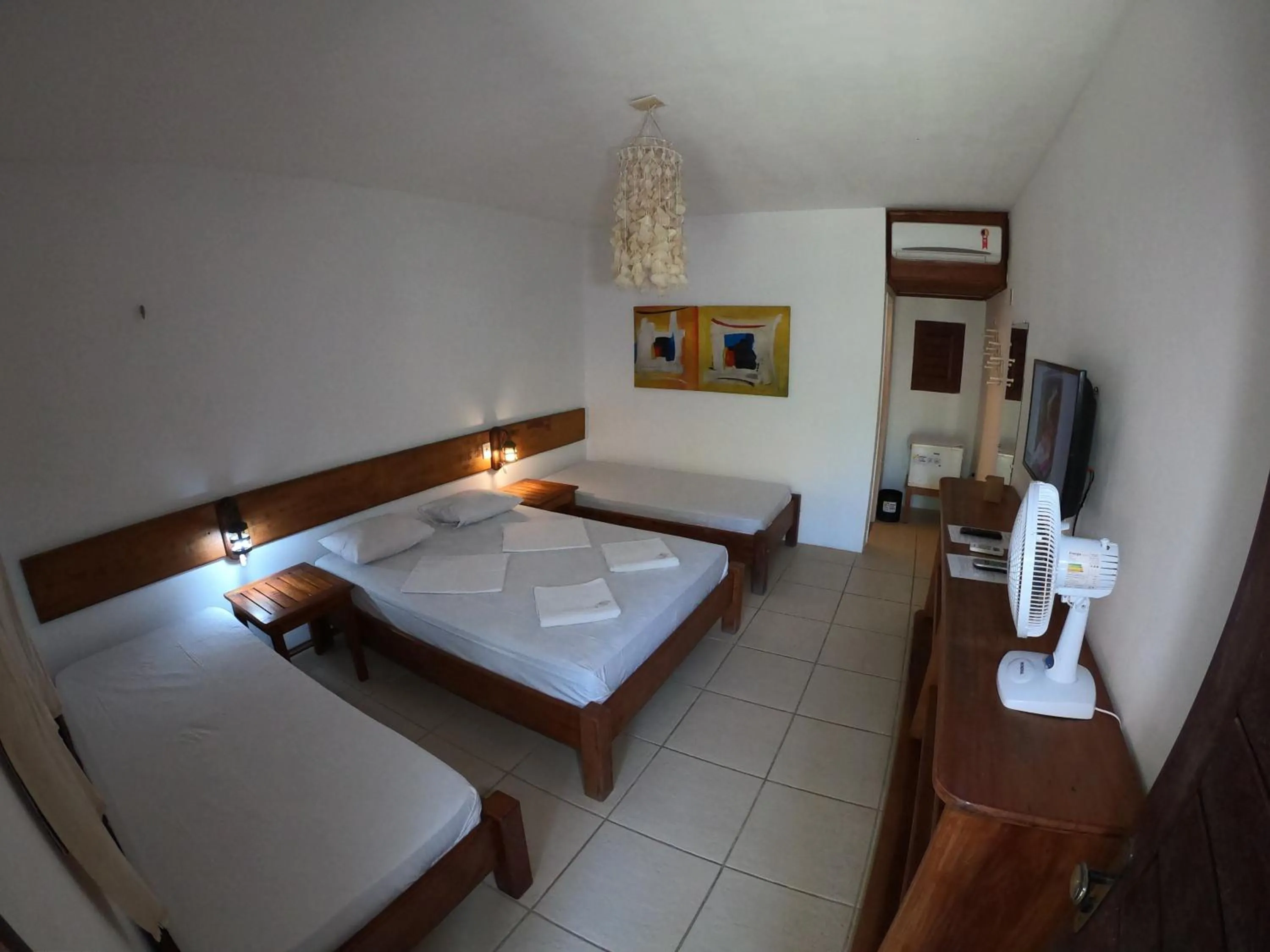 Bed in Pousada Casa Do Angelo