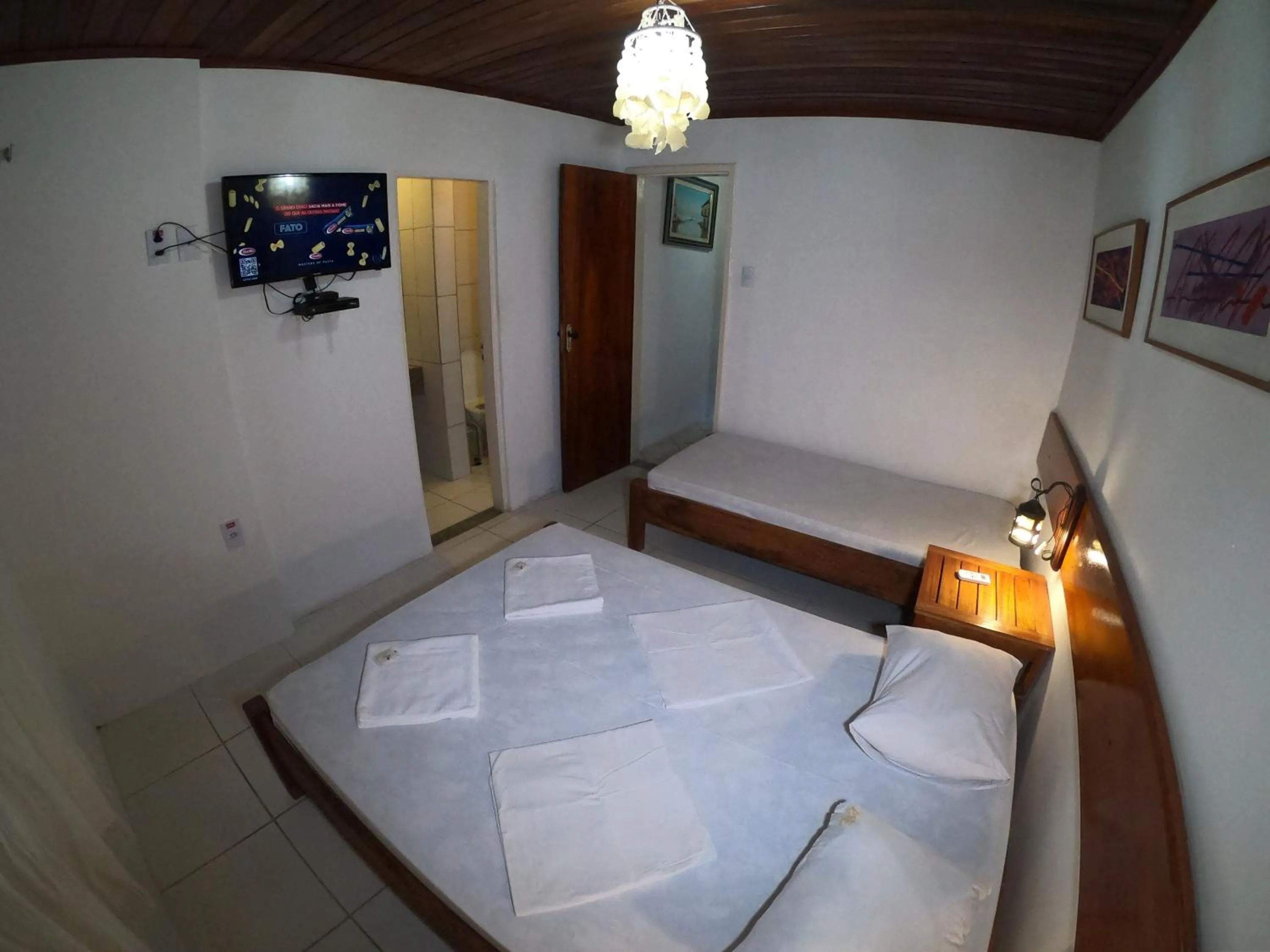 Bed in Pousada Casa Do Angelo