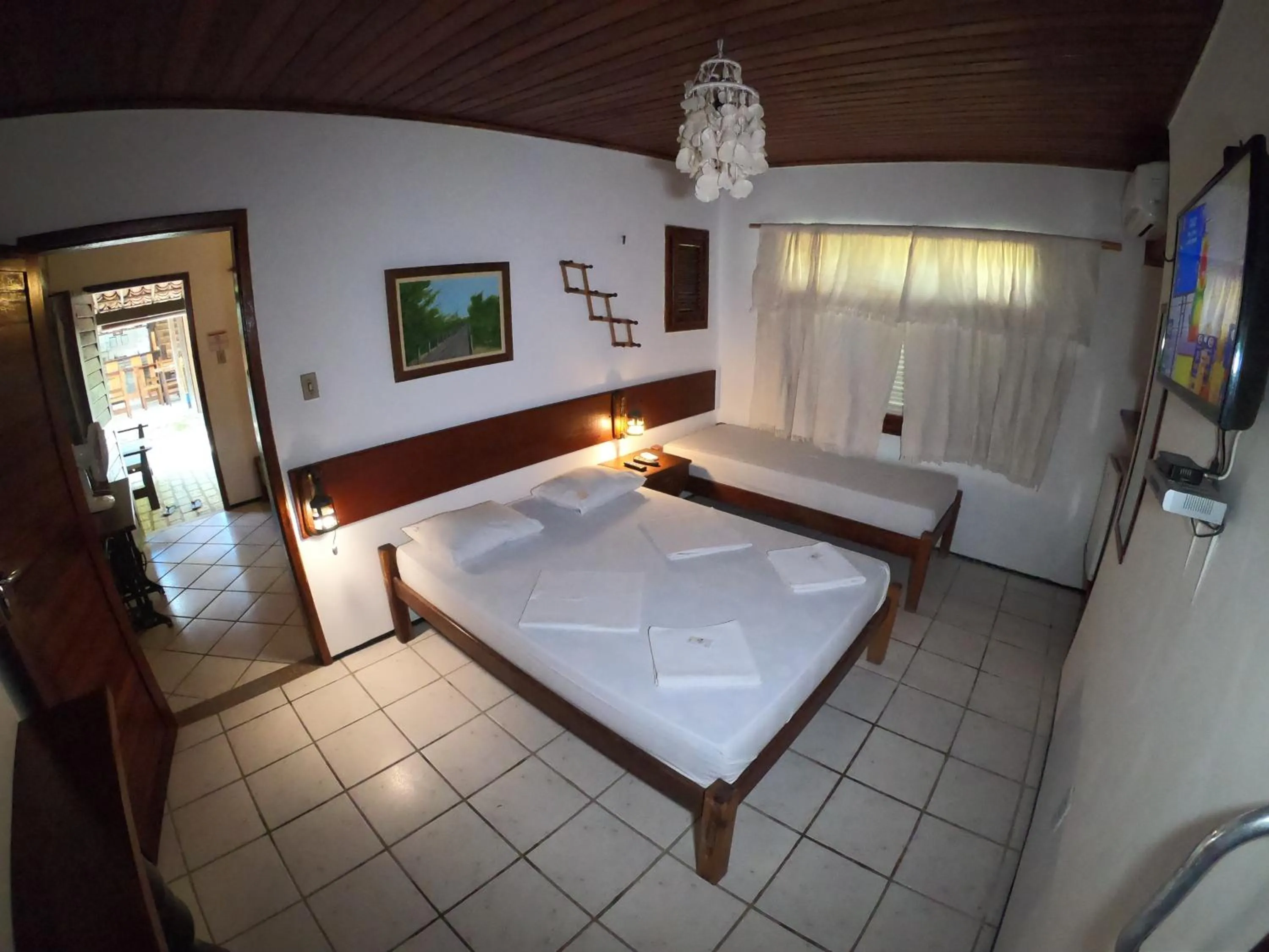 Bed in Pousada Casa Do Angelo