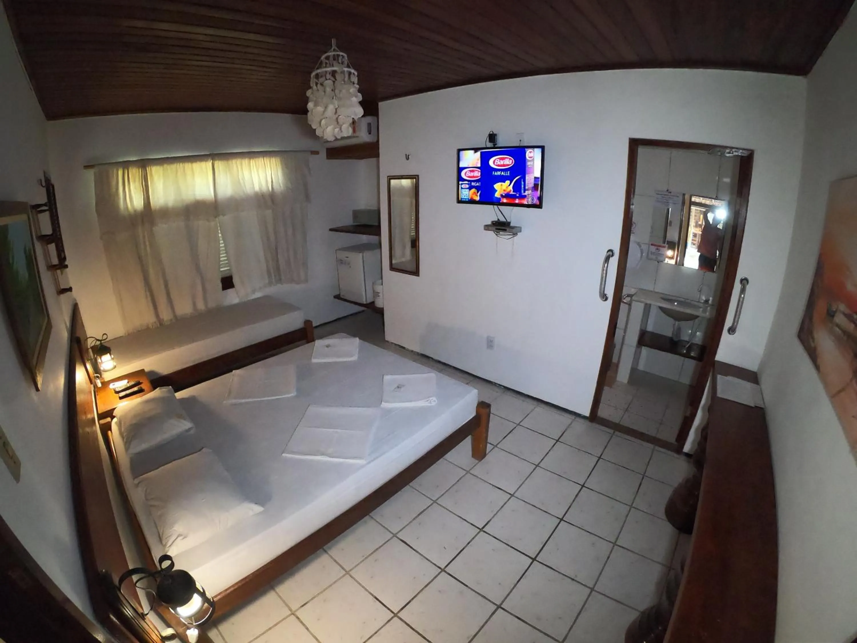 Bed in Pousada Casa Do Angelo