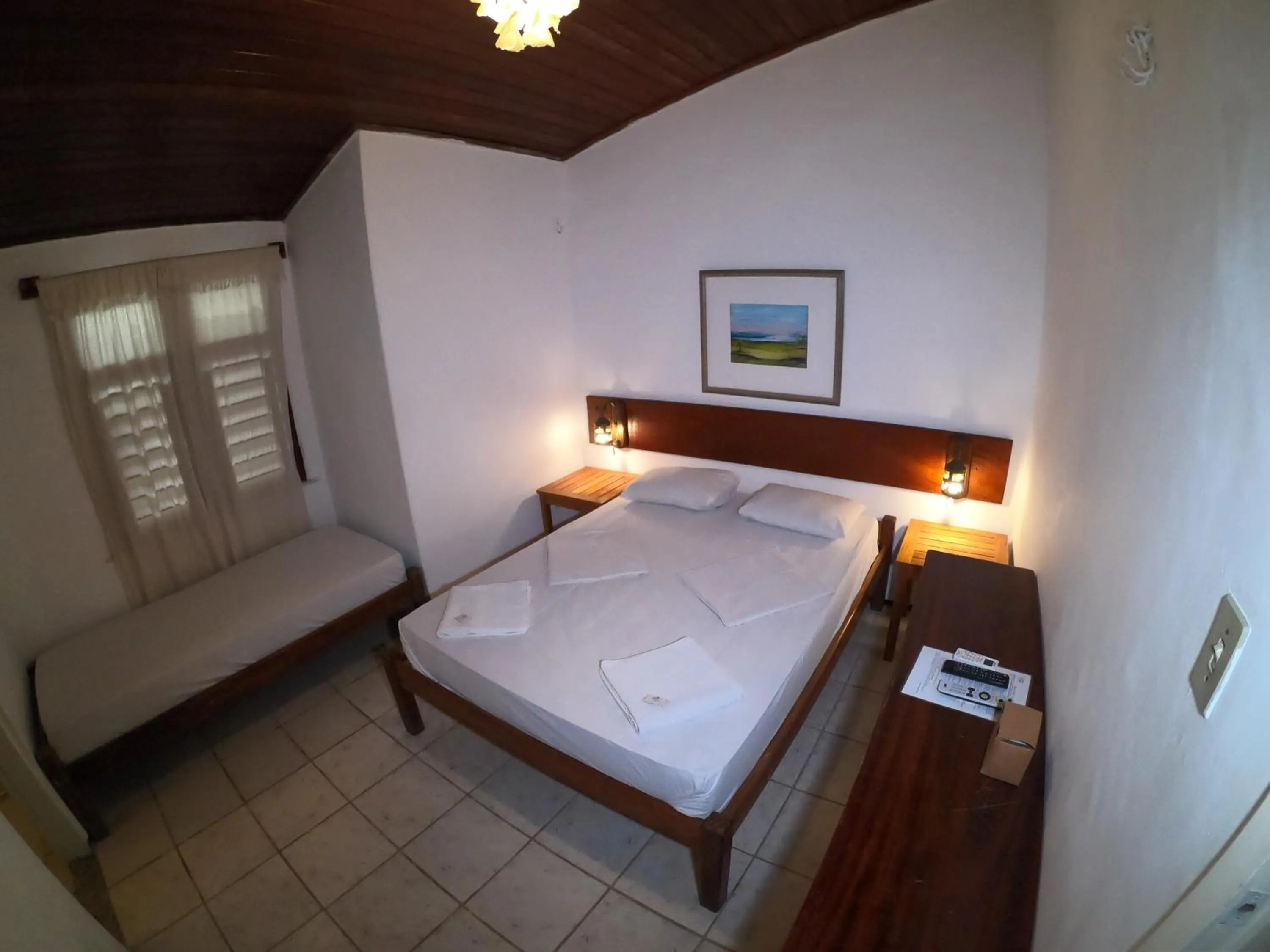 Bed in Pousada Casa Do Angelo