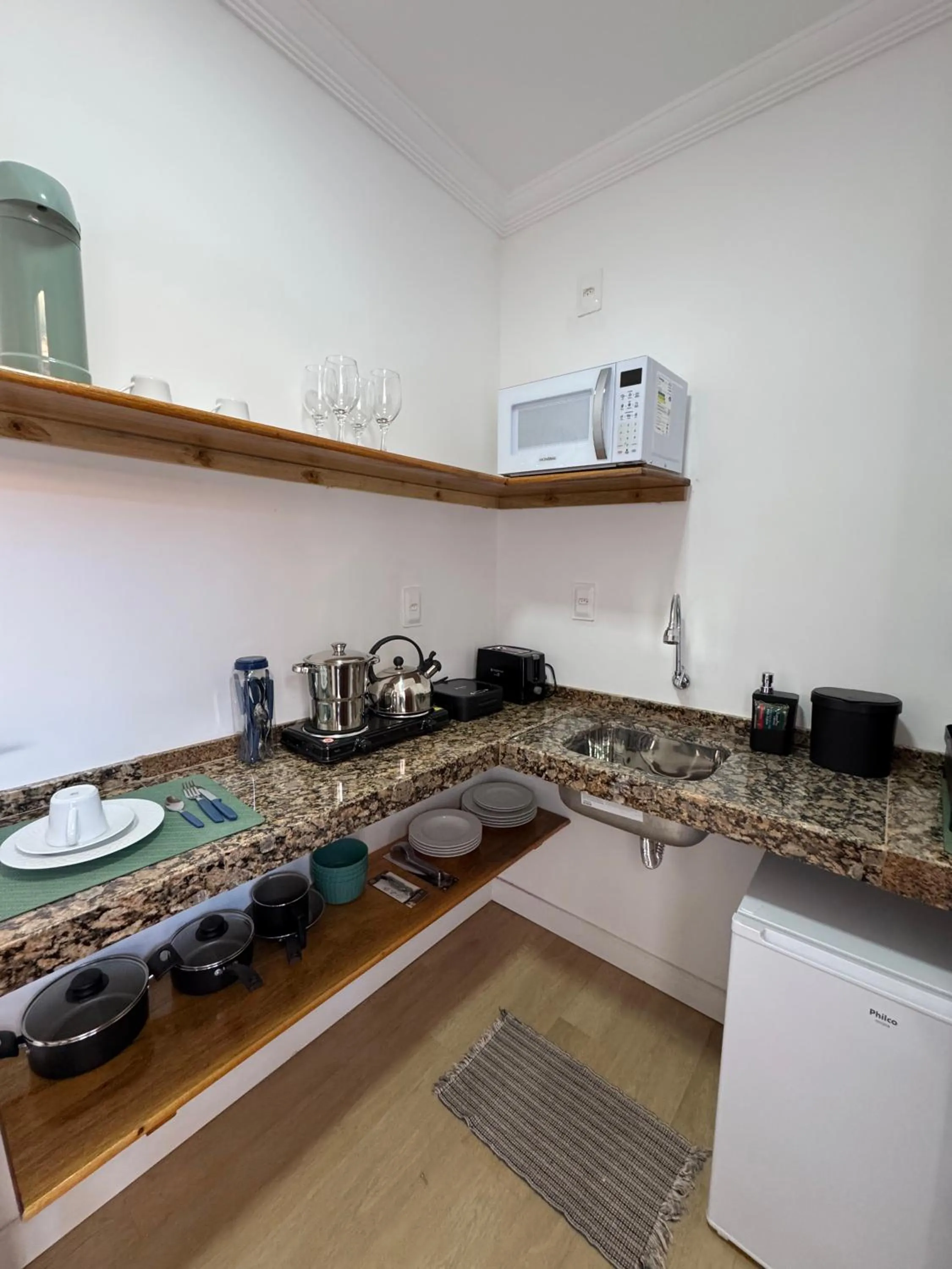 Kitchen or kitchenette in Pousada Capitão Thomaz