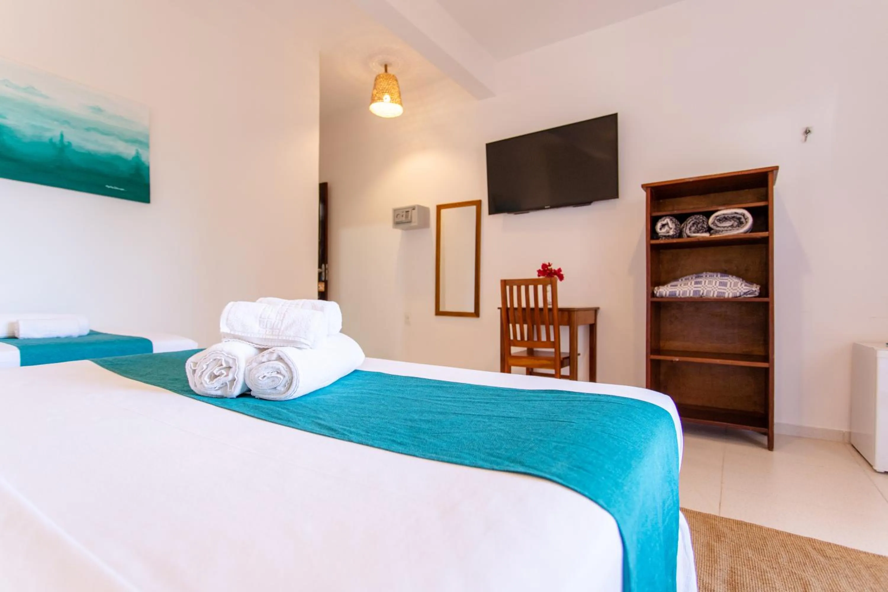 Bed in Pousada Capitão Thomaz