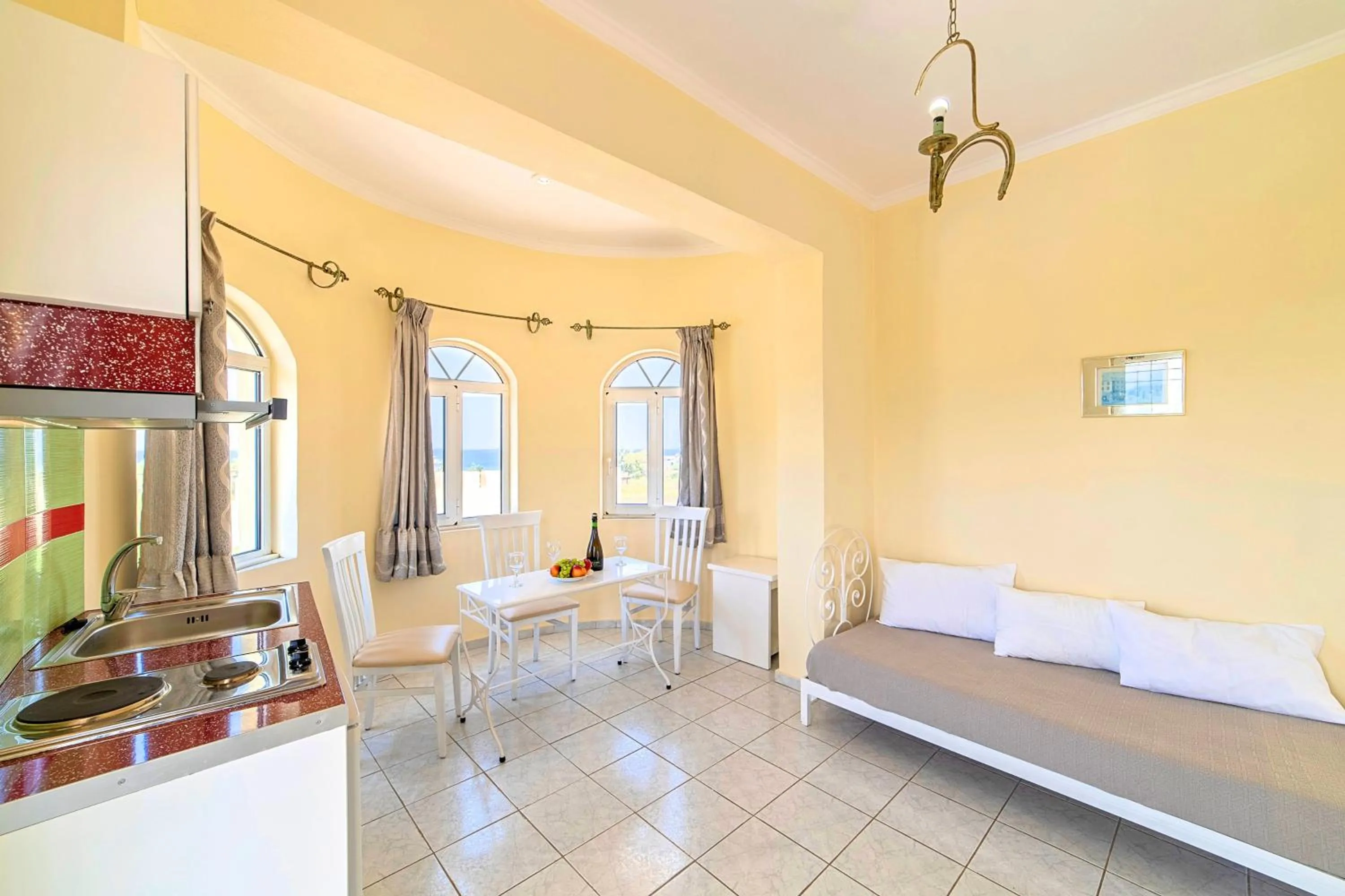 Kitchen or kitchenette, Bed in Palladion Hotel