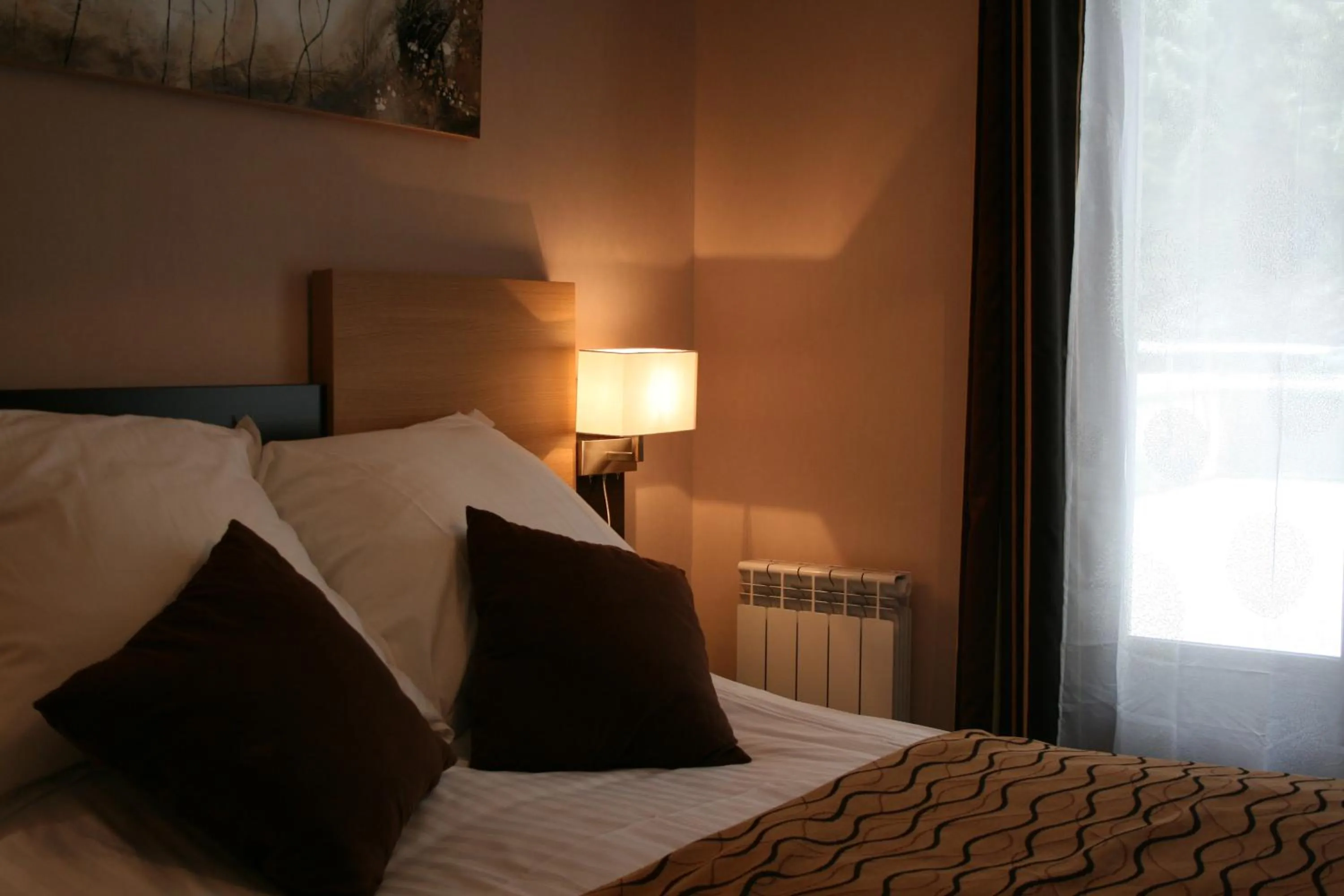 Bed in Auberge de la Petite Ferme, Super-Besse Est, The Originals Relais